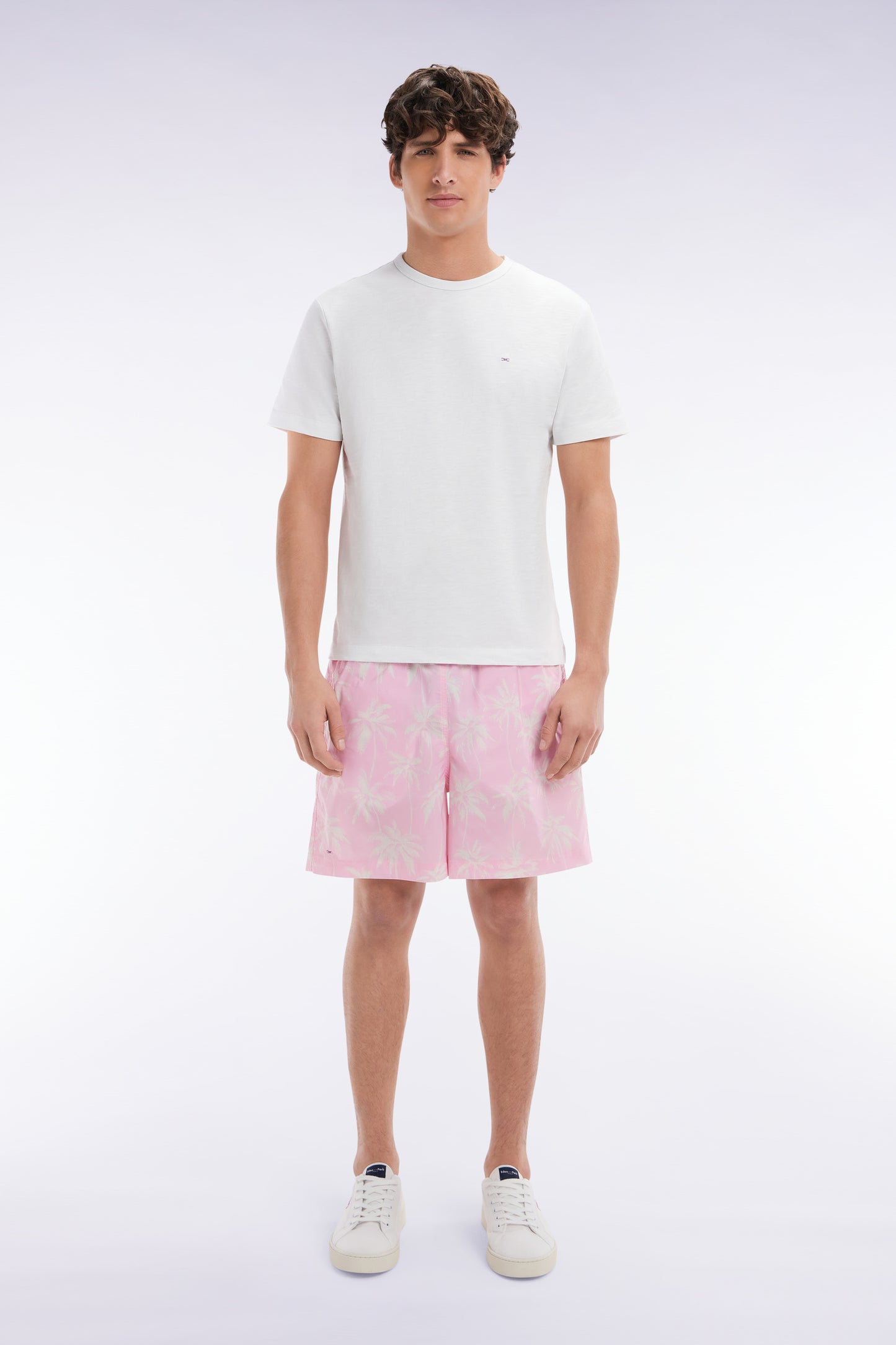 Pink swimsuit with palm tree print
