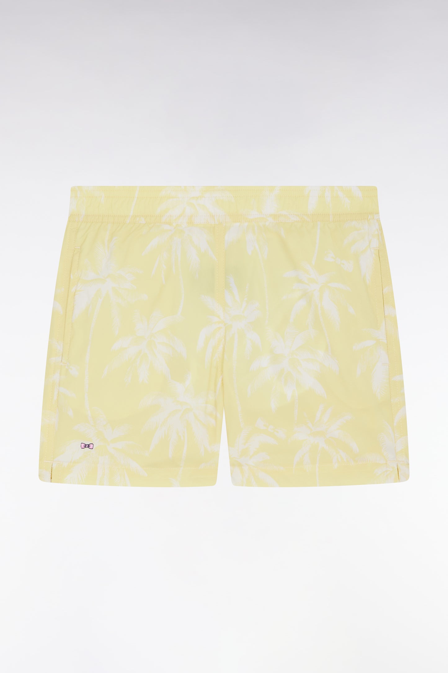 Yellow children's swimsuit with palm tree print