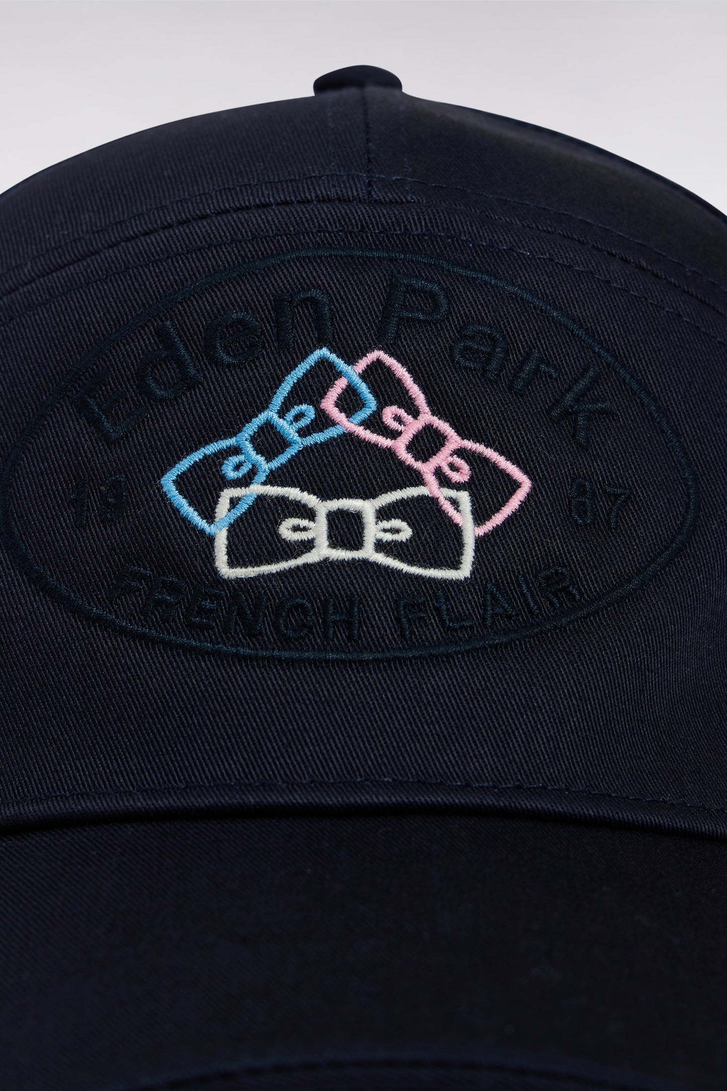 Navy cotton twill cap with bow tie embroidery