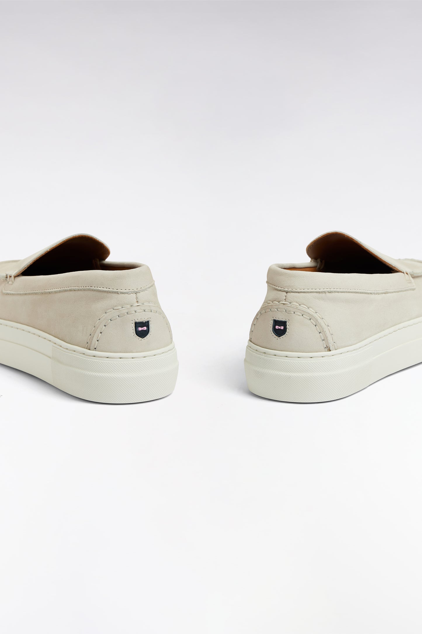 Loafers with sneakers soles in ecru suede leather