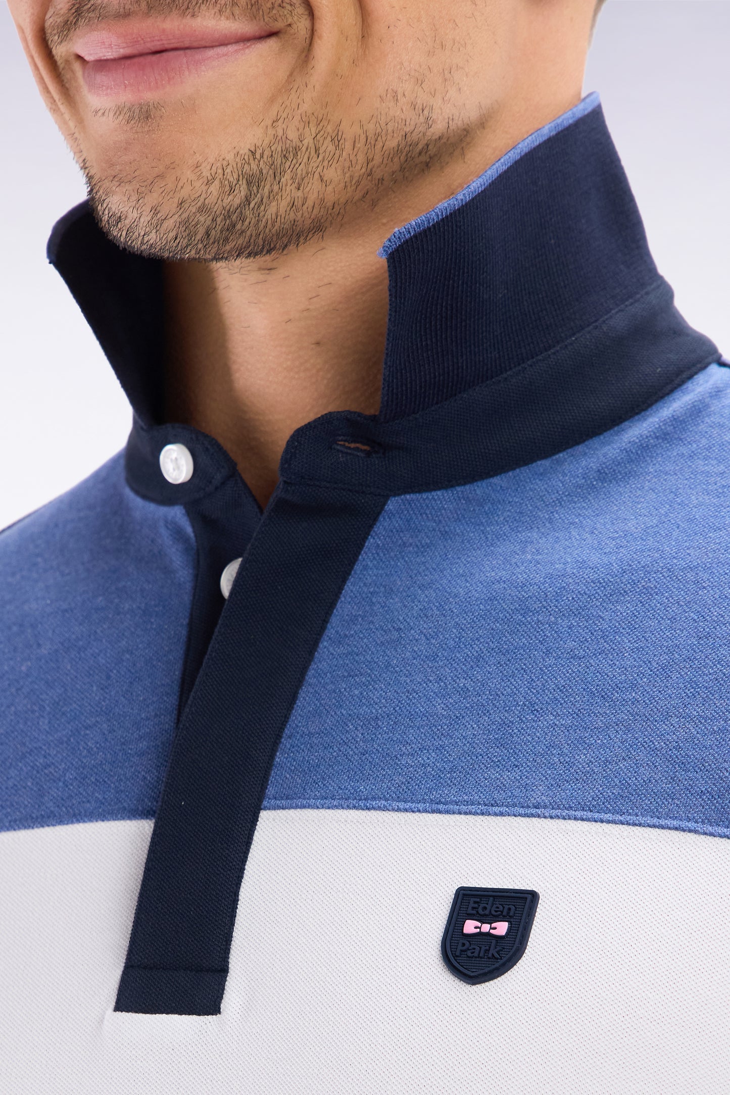 Slim-fit short-sleeved polo shirt in blue stretch cotton with contrasted stripe