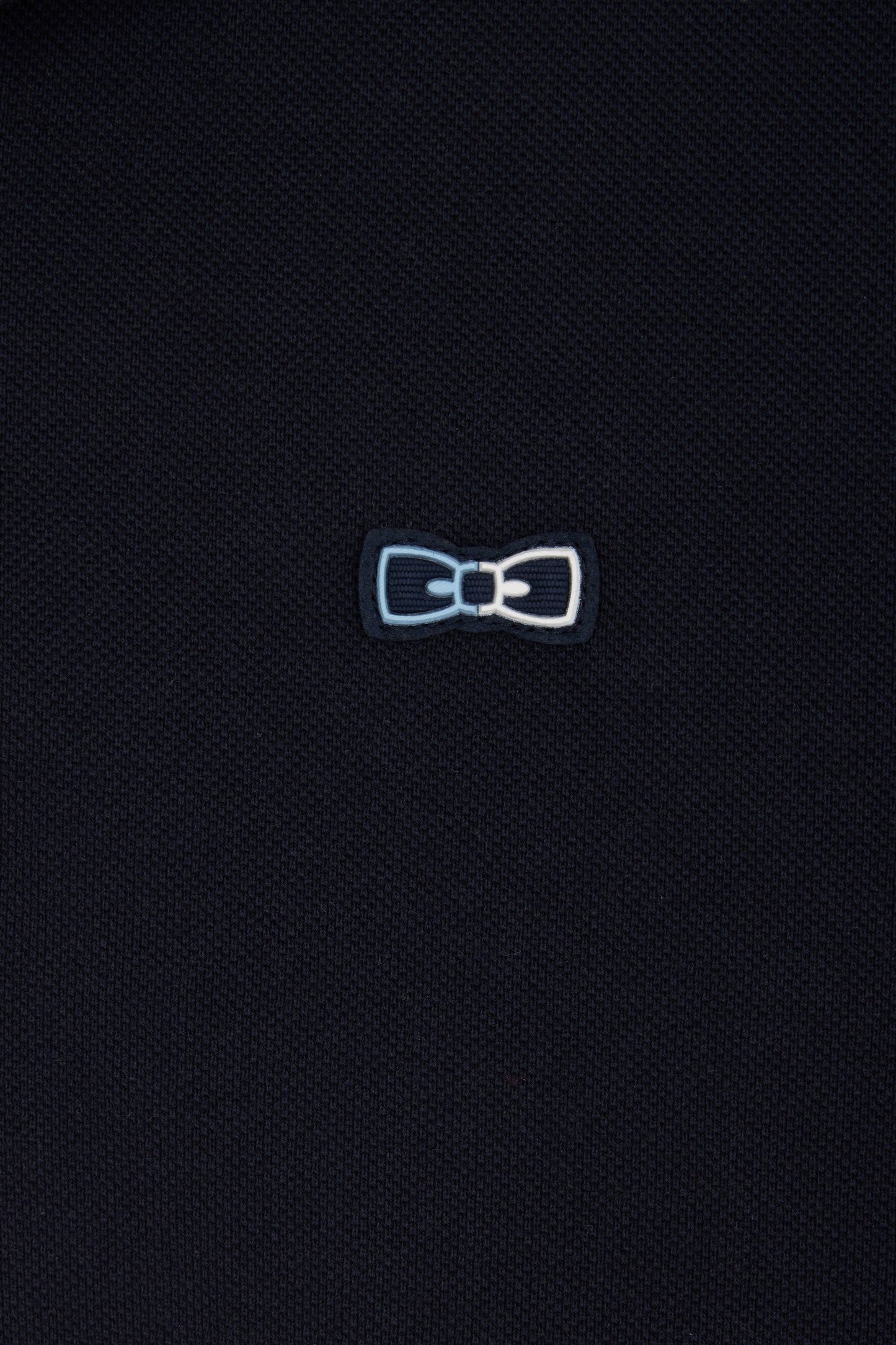 Relaxed-fit short-sleeved polo shirt in navy cotton with piped collar