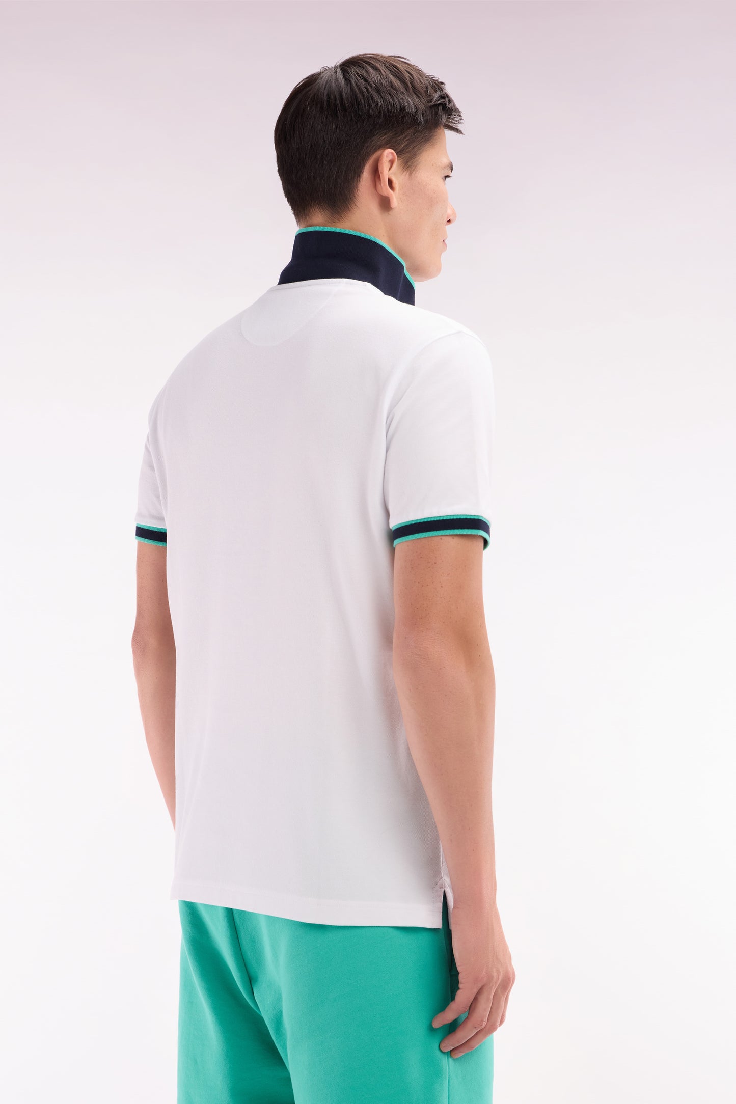 Relaxed-fit short-sleeved polo shirt in green cotton with colorful stripes