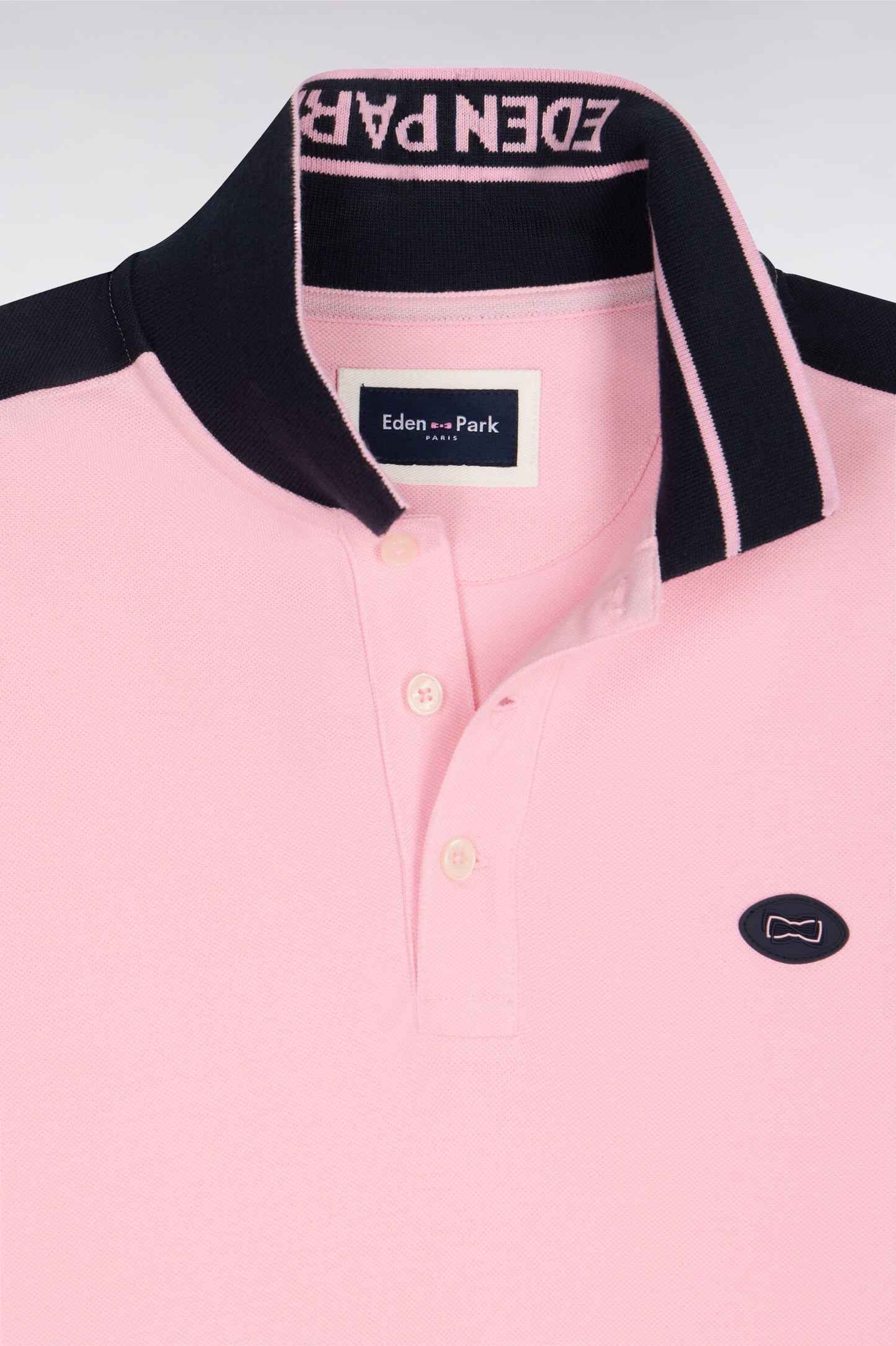 Short-sleeved polo shirt in pink cotton pique with navy cutouts
