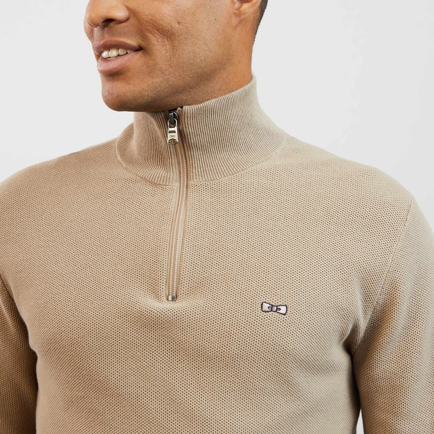 Beige zip-neck jumper in decorative cable knit