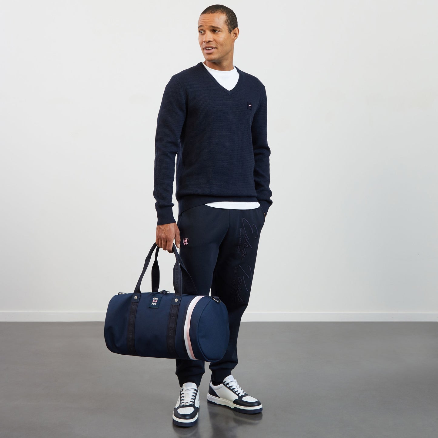 White T-shirt with embroidered bow tie on the back