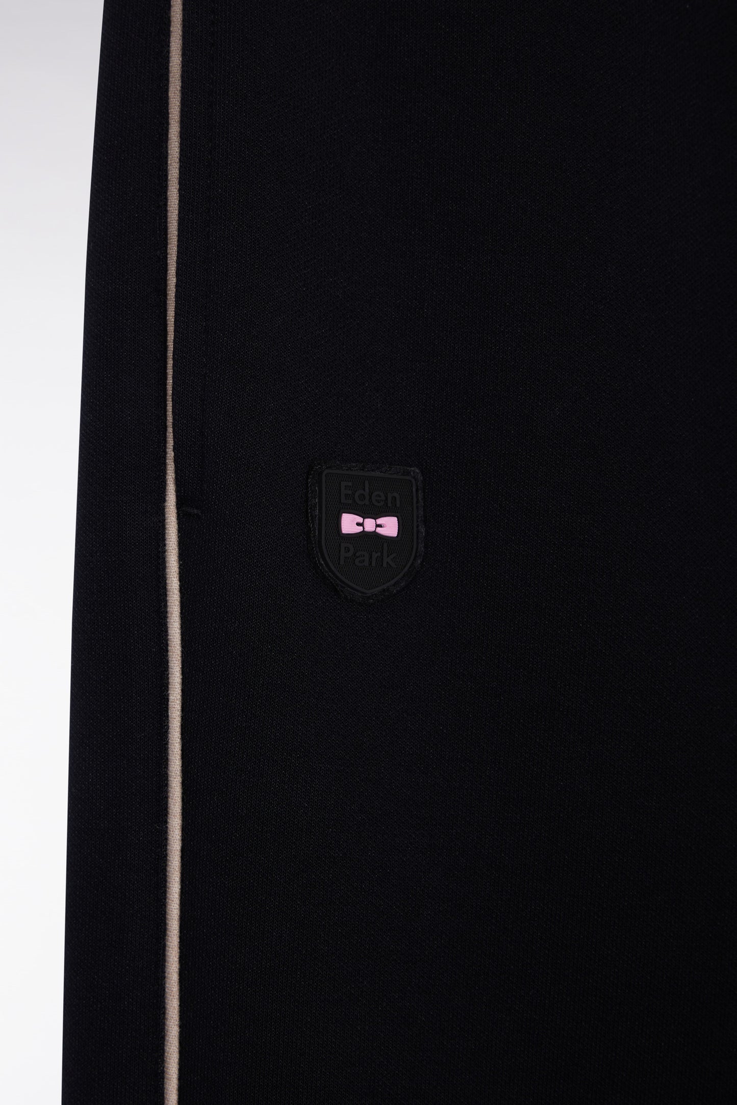 Black brushed fleece jogging suit with piping and front pleats, straight cut