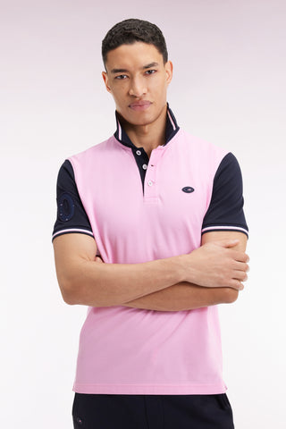 Short-sleeved pink and navy polo shirt with tricolored trim, straight cut