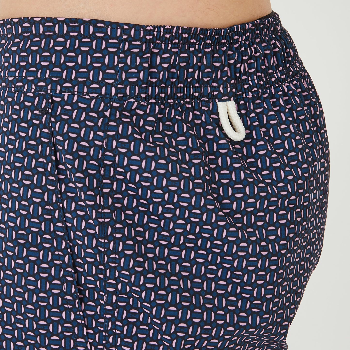 Pink swim shorts with micro motif