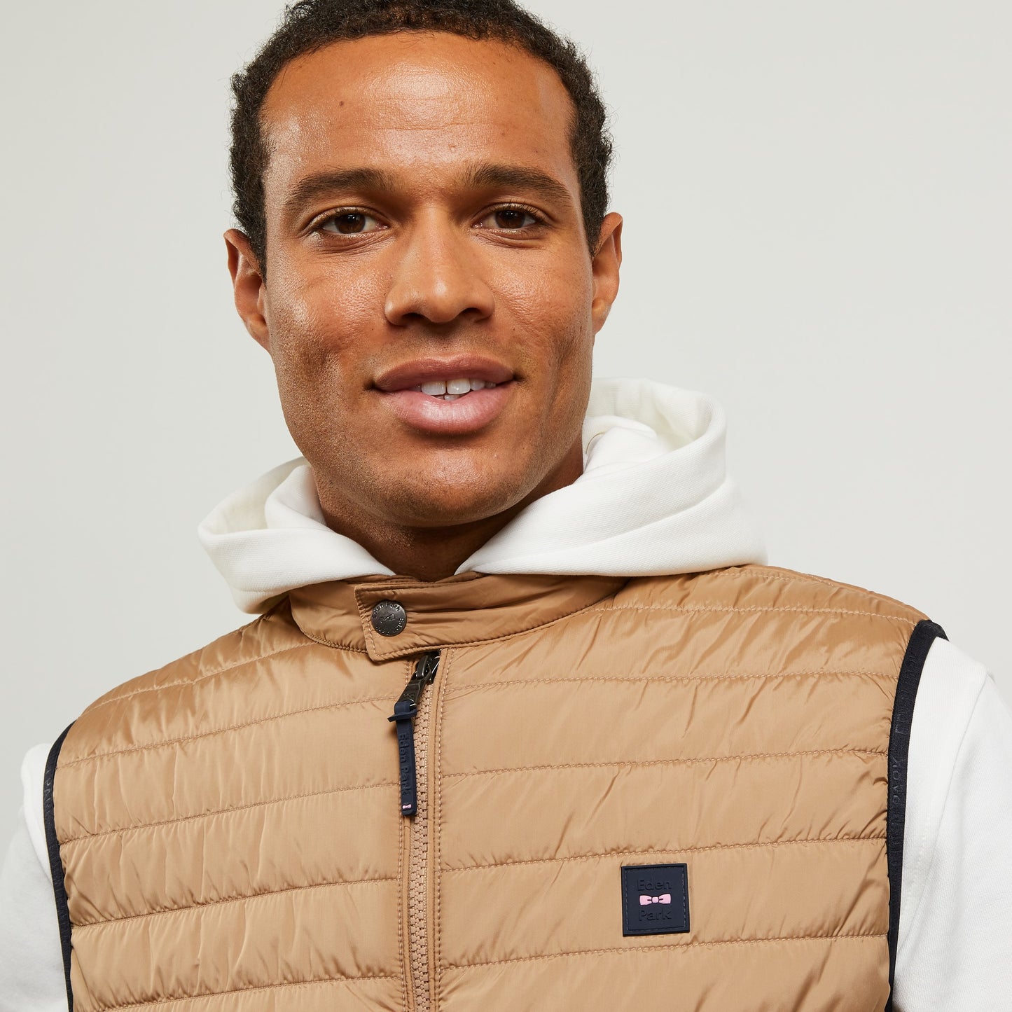 Beige sleeveless puffa jacket