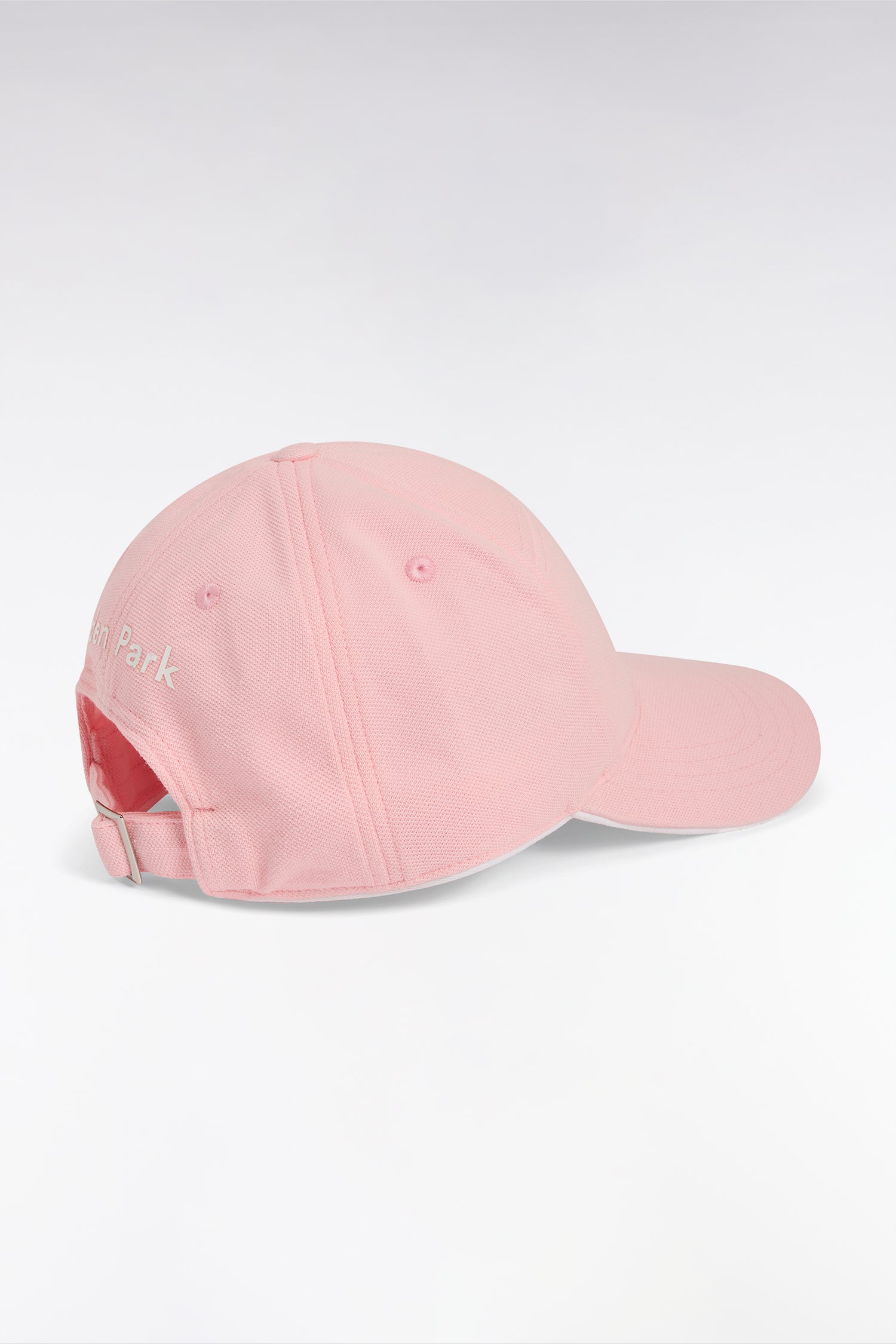 Casquette en piqué de coton rose badge gomme nœud papillon