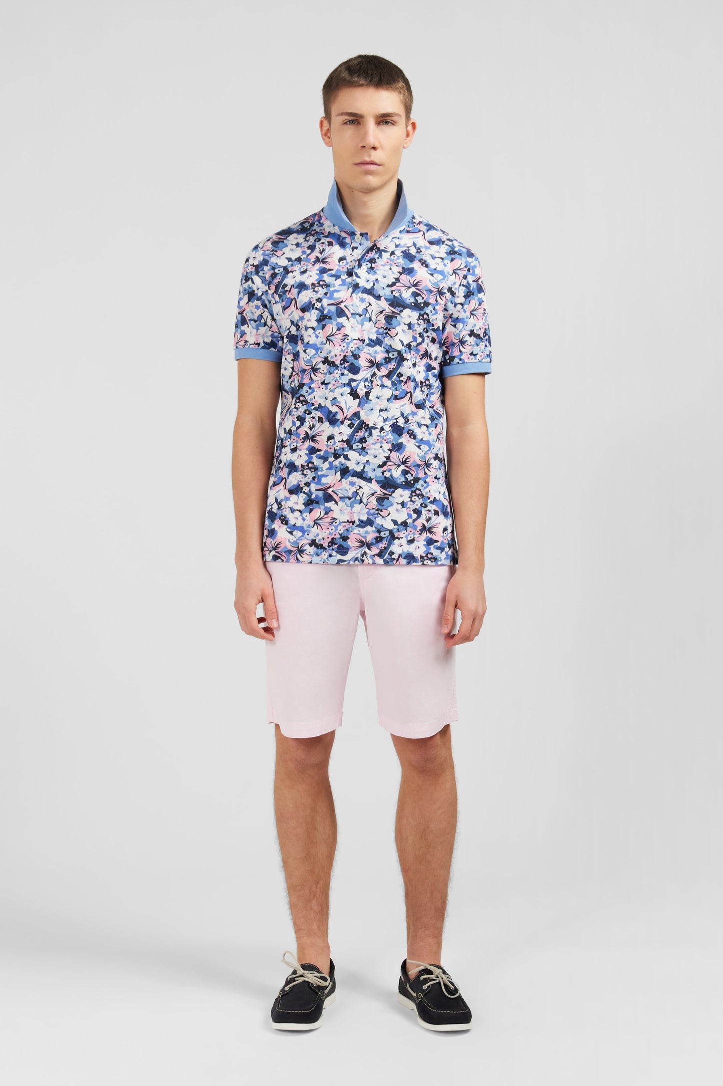 Light blue short-sleeved polo shirt with flower print