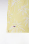 Yellow children's swimsuit with palm tree print