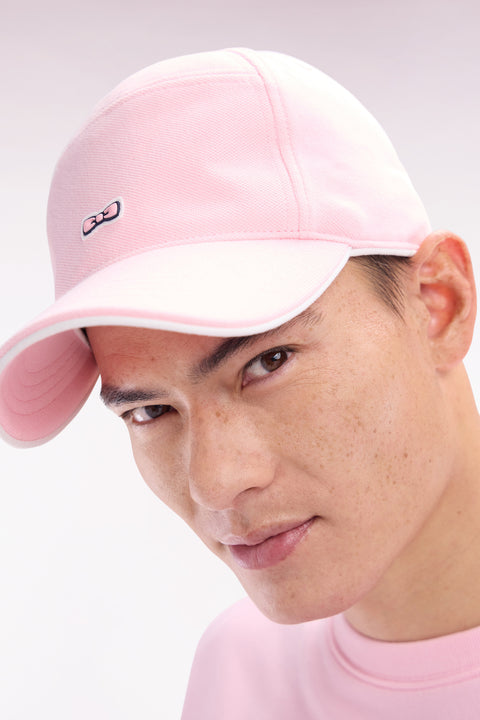 Pink cotton piqué cap with rubber bow tie badge - Image 1