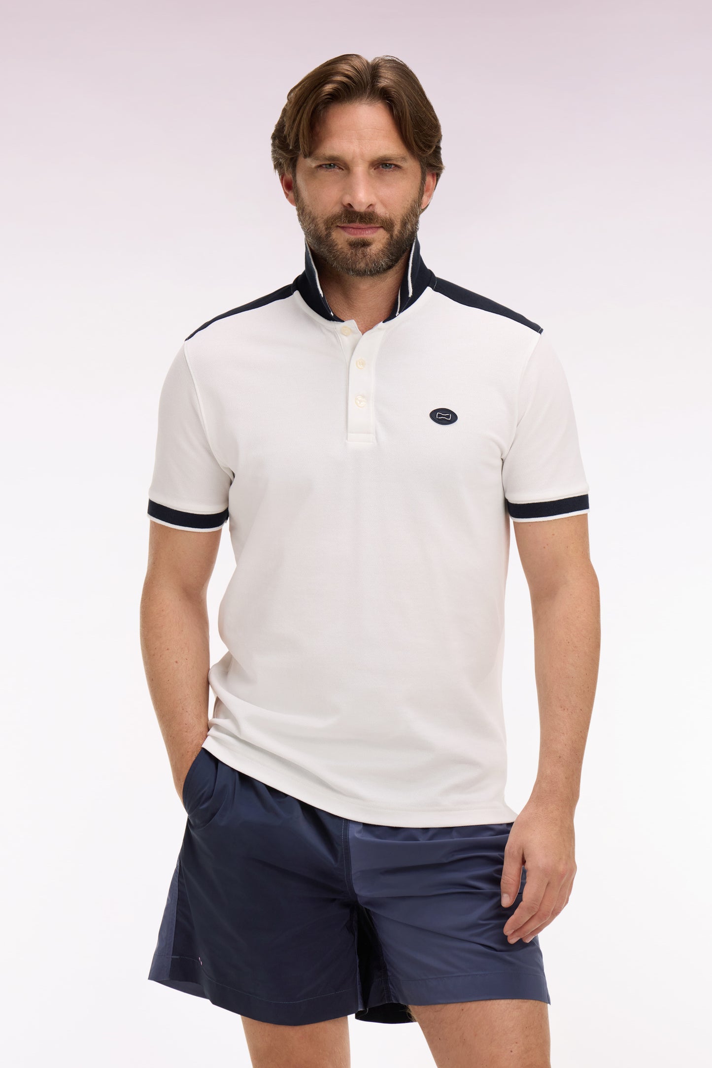 Short-sleeved polo shirt in ecru cotton pique with navy cutouts