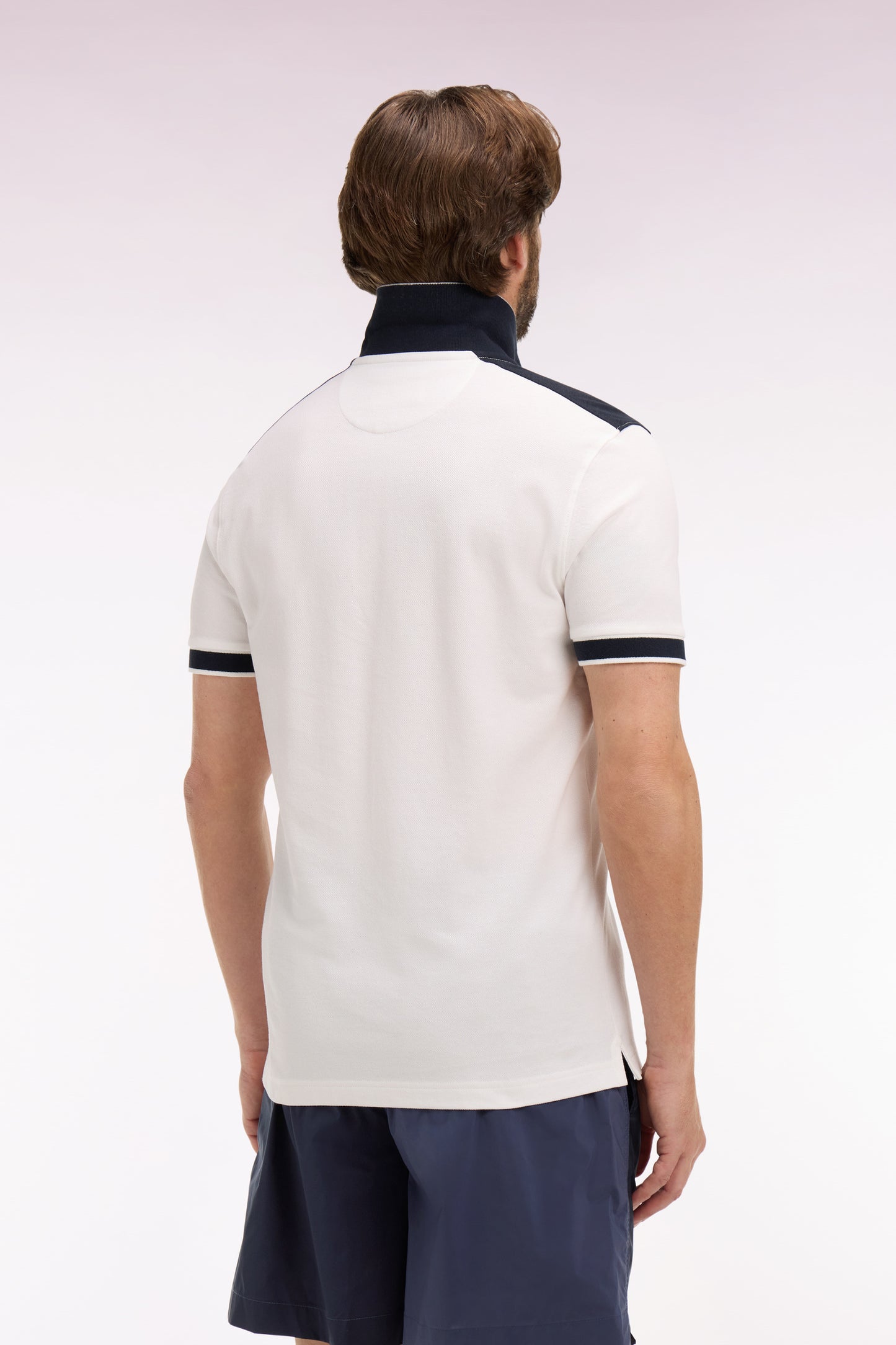 Short-sleeved polo shirt in ecru cotton pique with navy cutouts