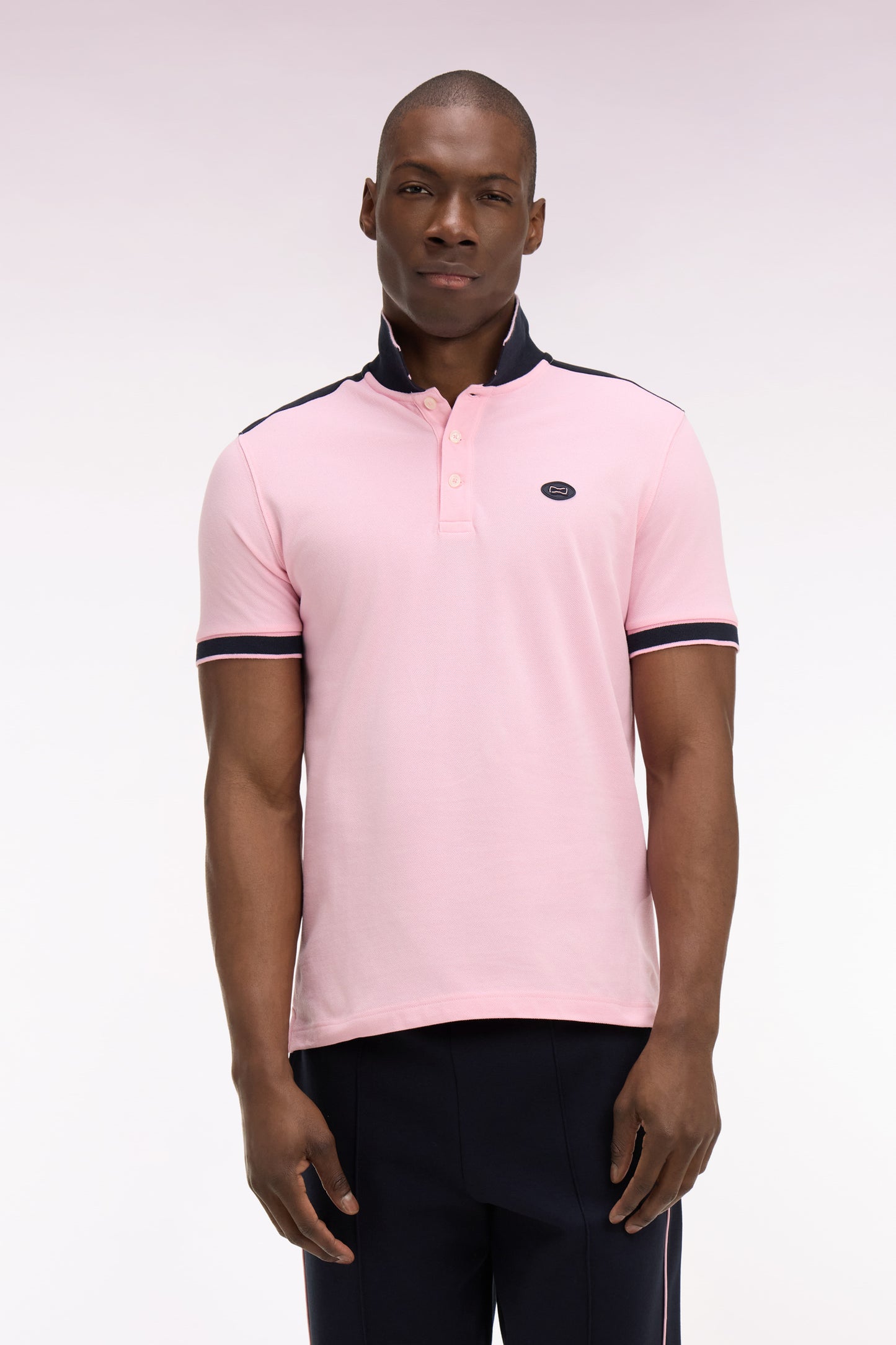 Short-sleeved polo shirt in pink cotton pique with navy cutouts