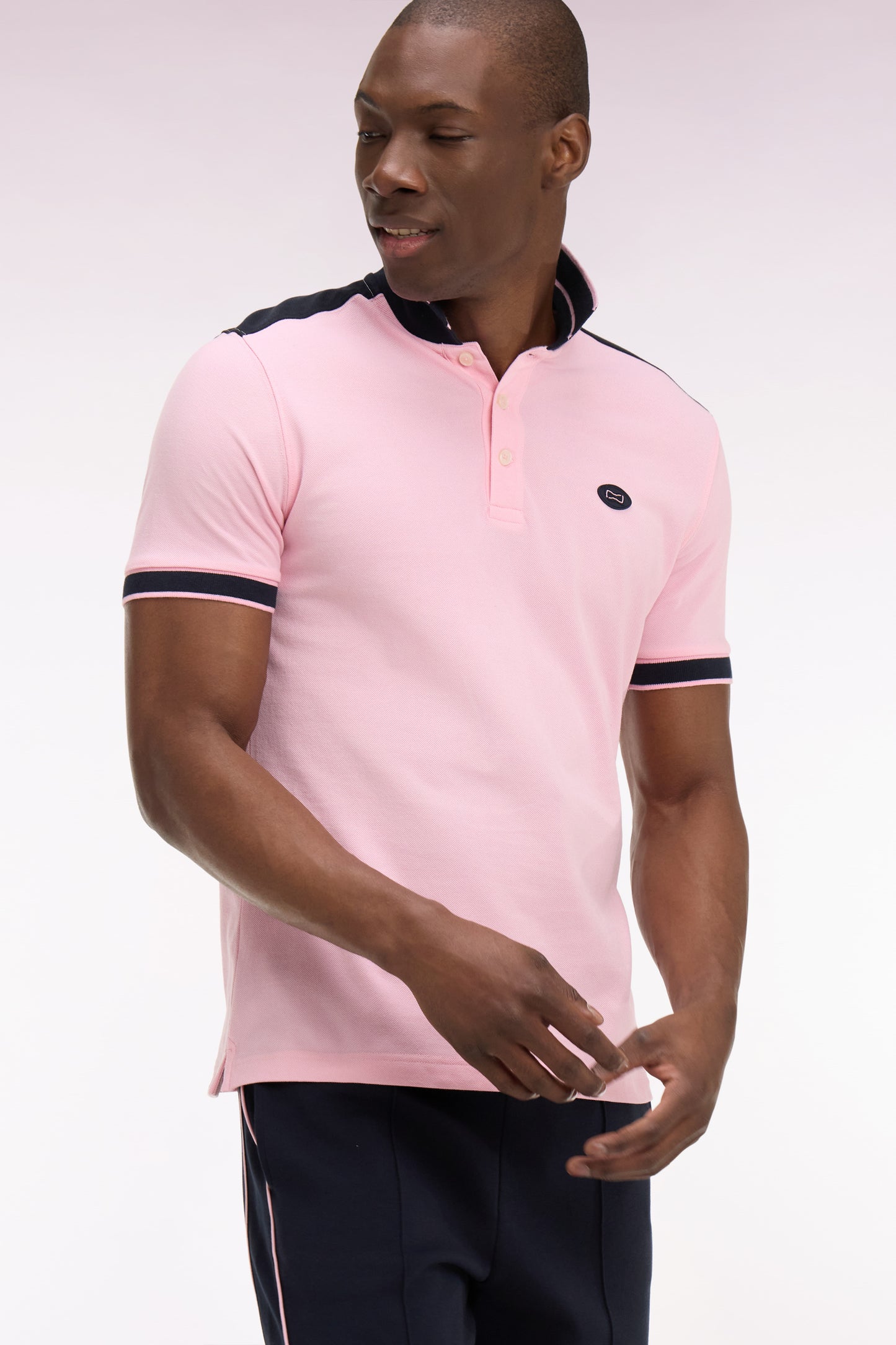 Short-sleeved polo shirt in pink cotton pique with navy cutouts