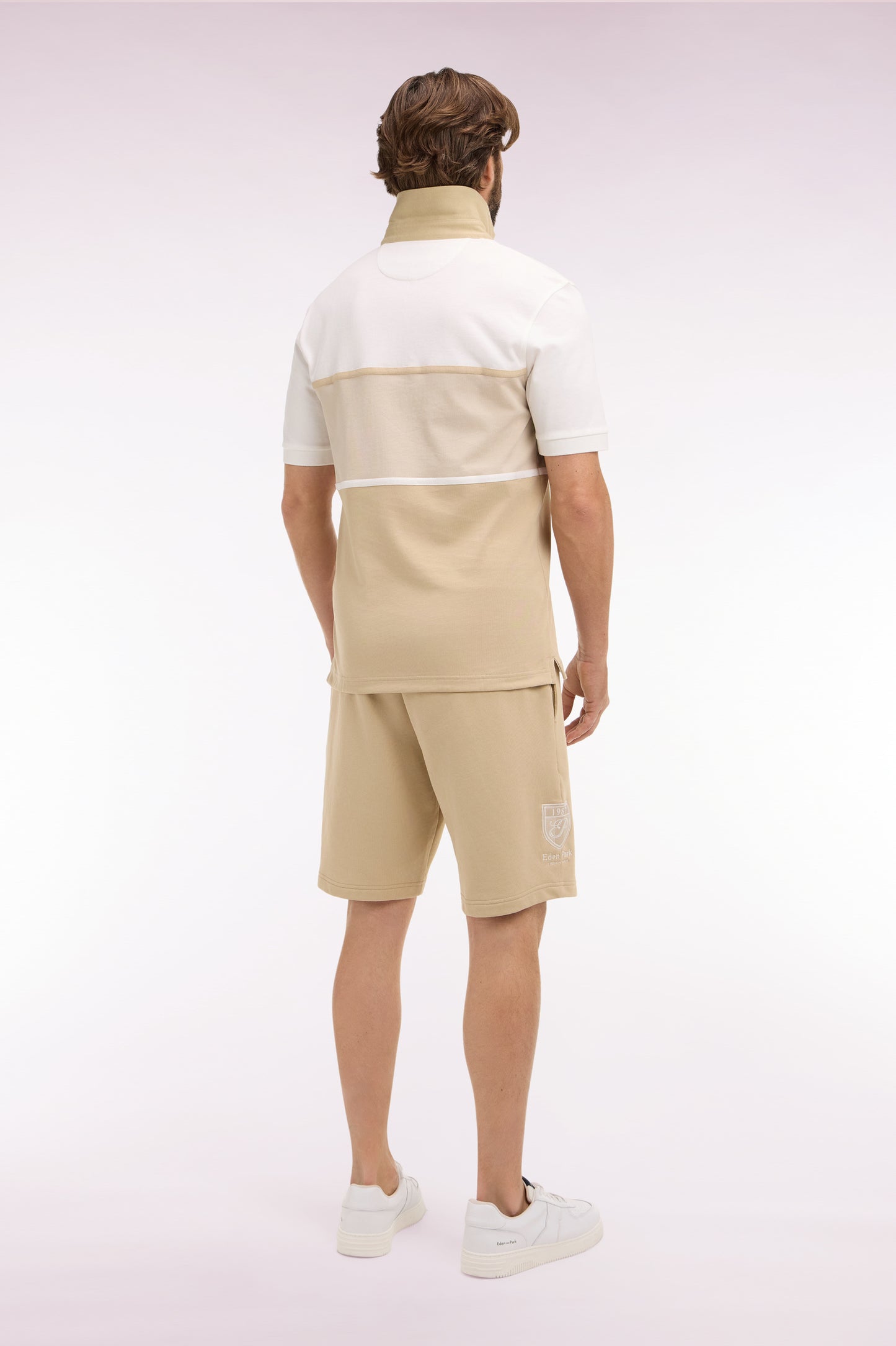 Beige cotton fleece shorts with coat of arms embroidery