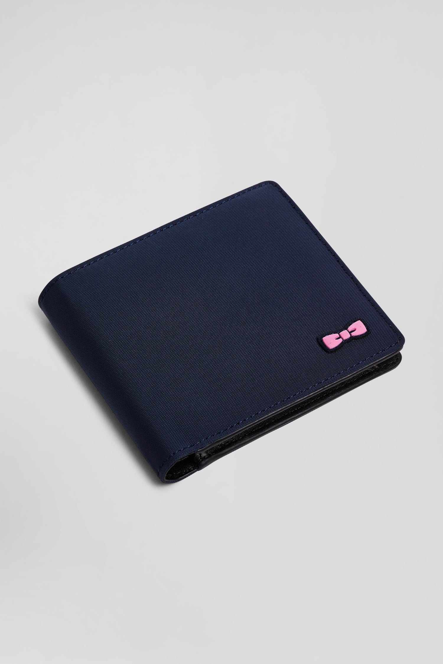 Navy blue Italian-style wallet with pink ribbon