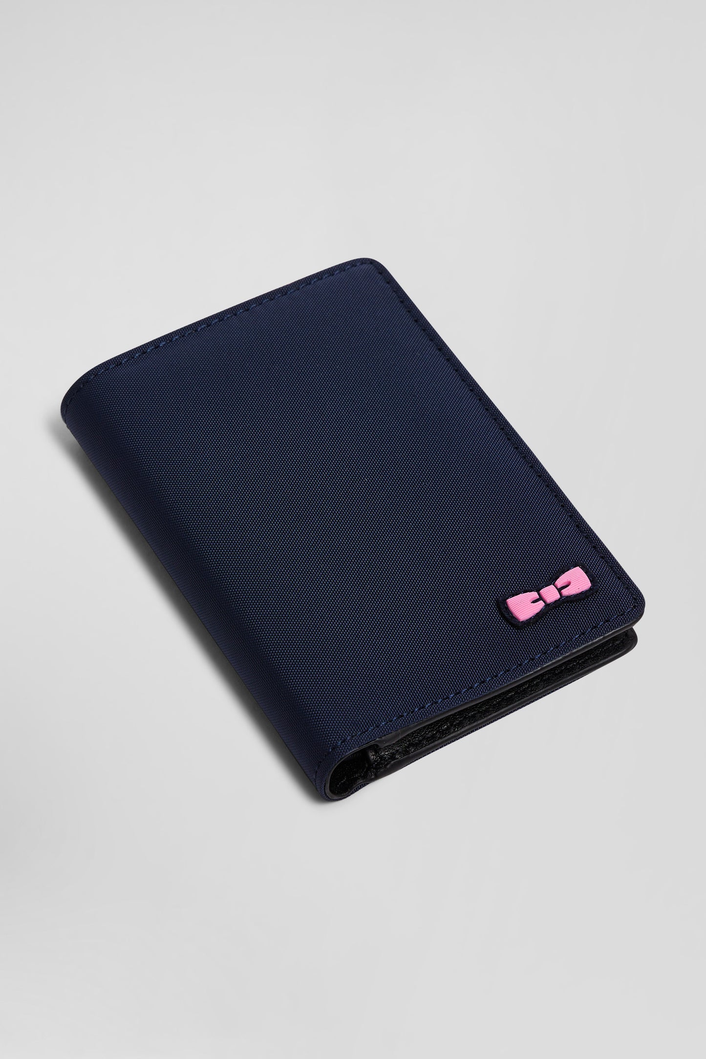 Navy blue French-style wallet with pink ribbon