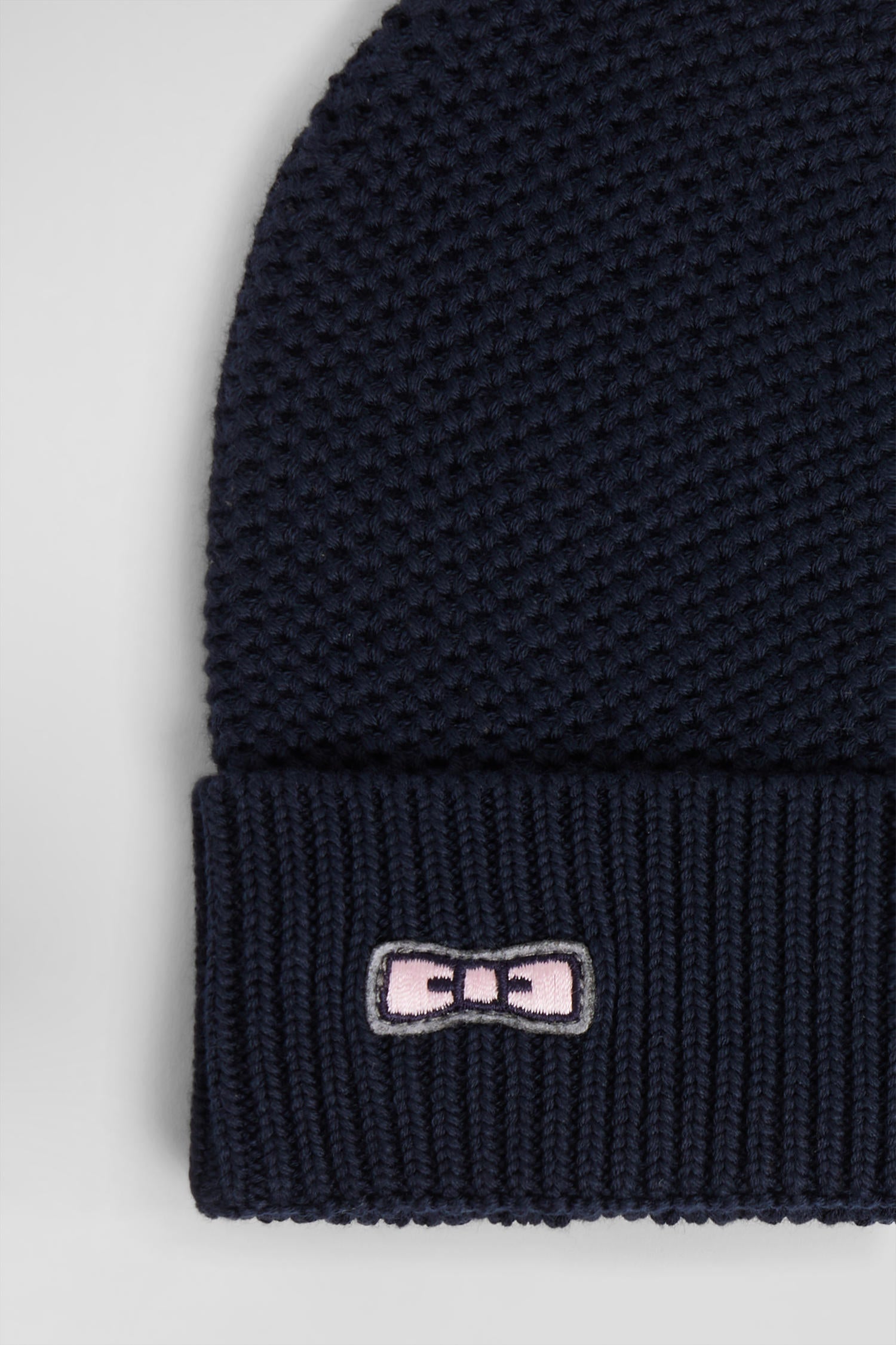 Plain navy blue cotton beanie with bow tie embroidery