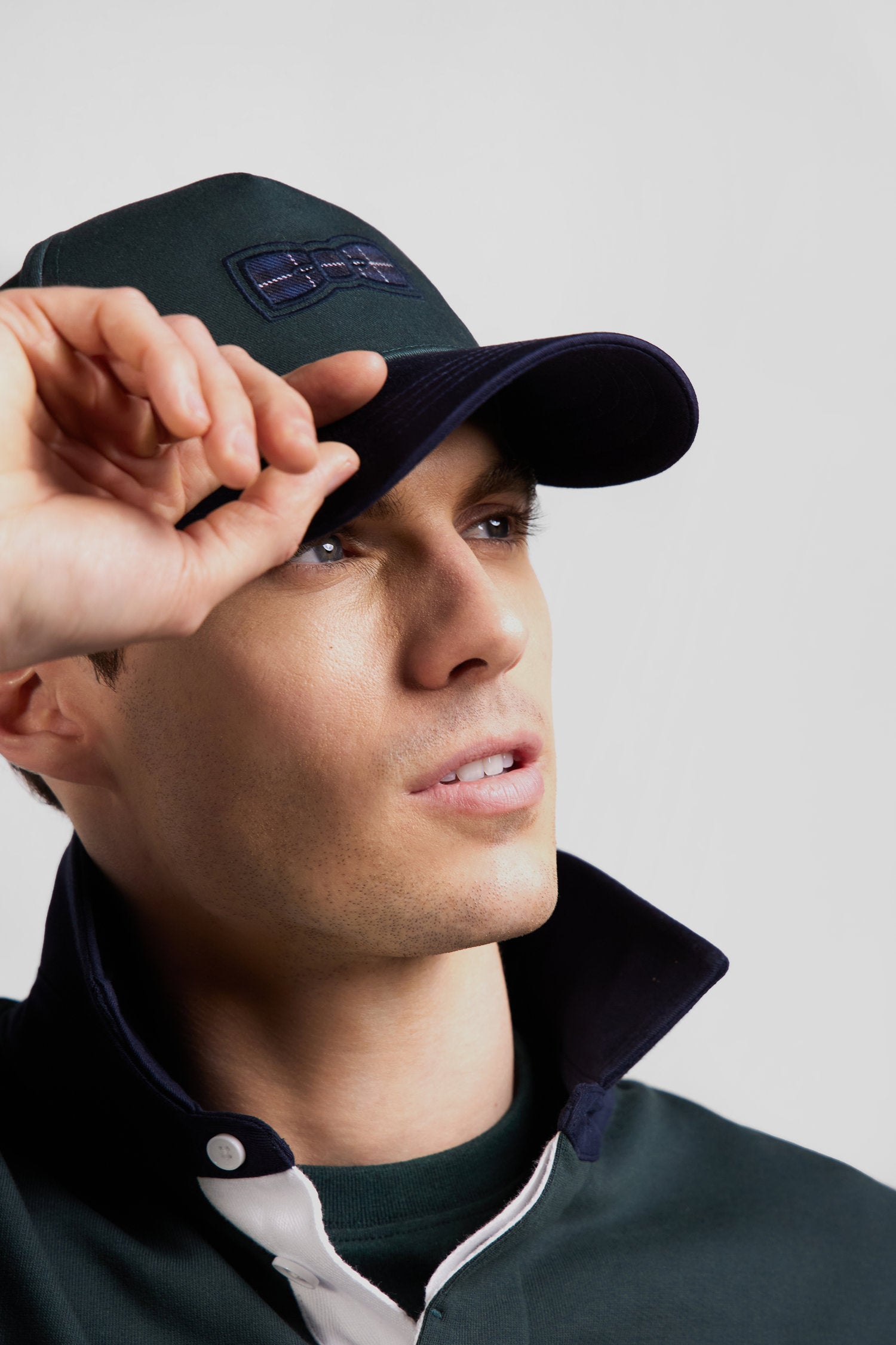 Green and navy cotton cap with tricolour details