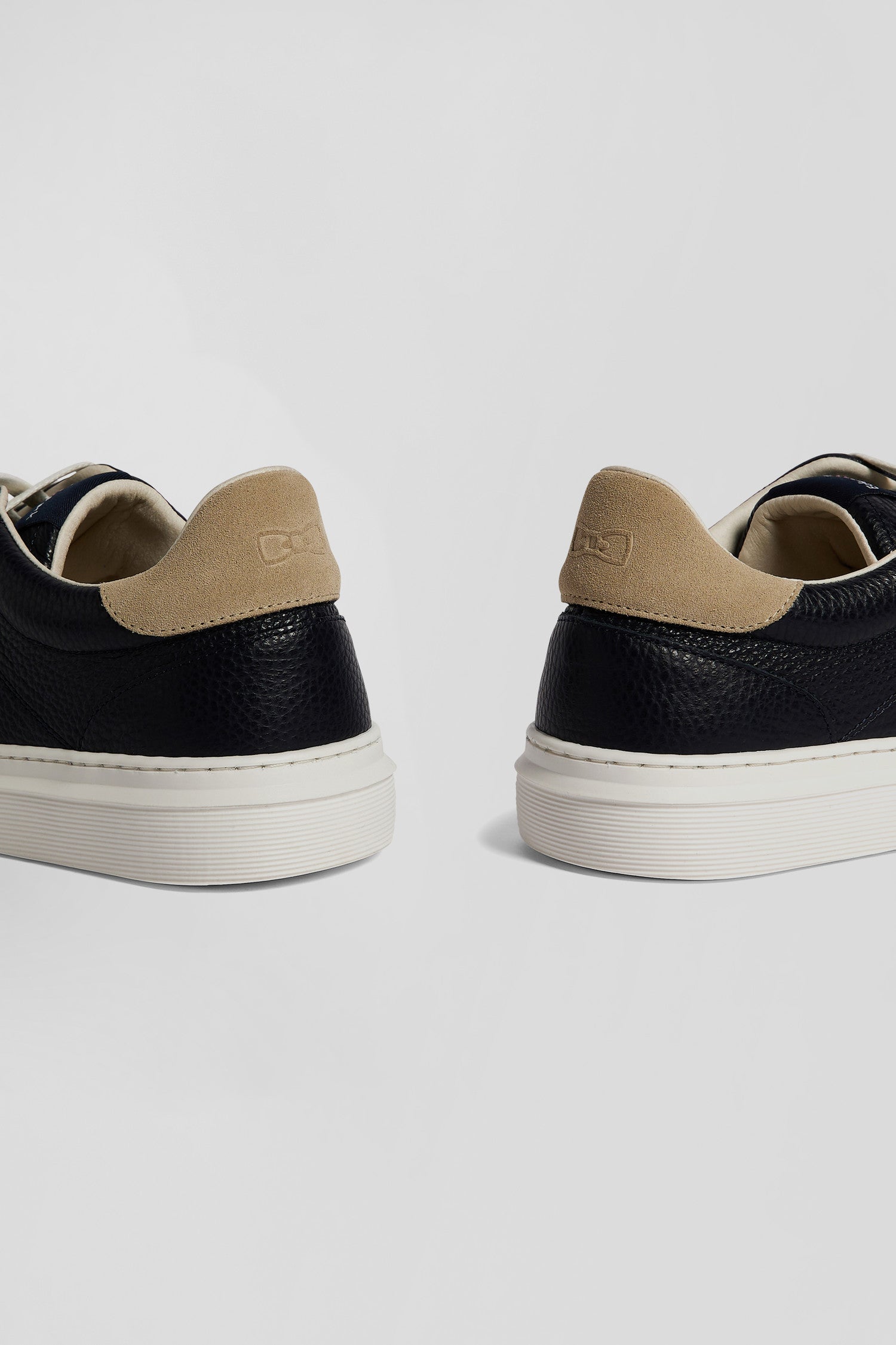 Navy low-top leather sneakers