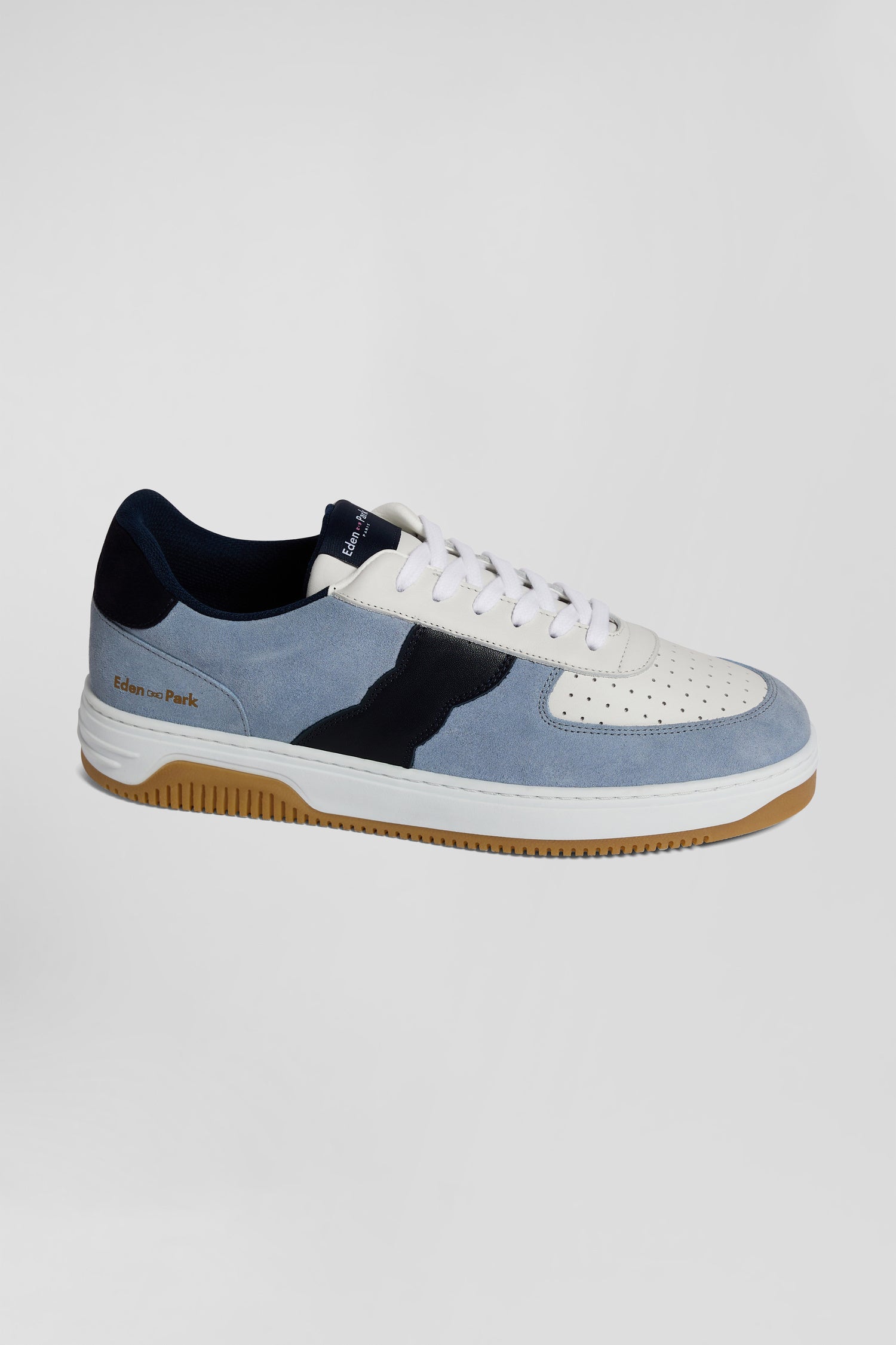 Sky blue low-top leather sneakers with navy blue cut-out