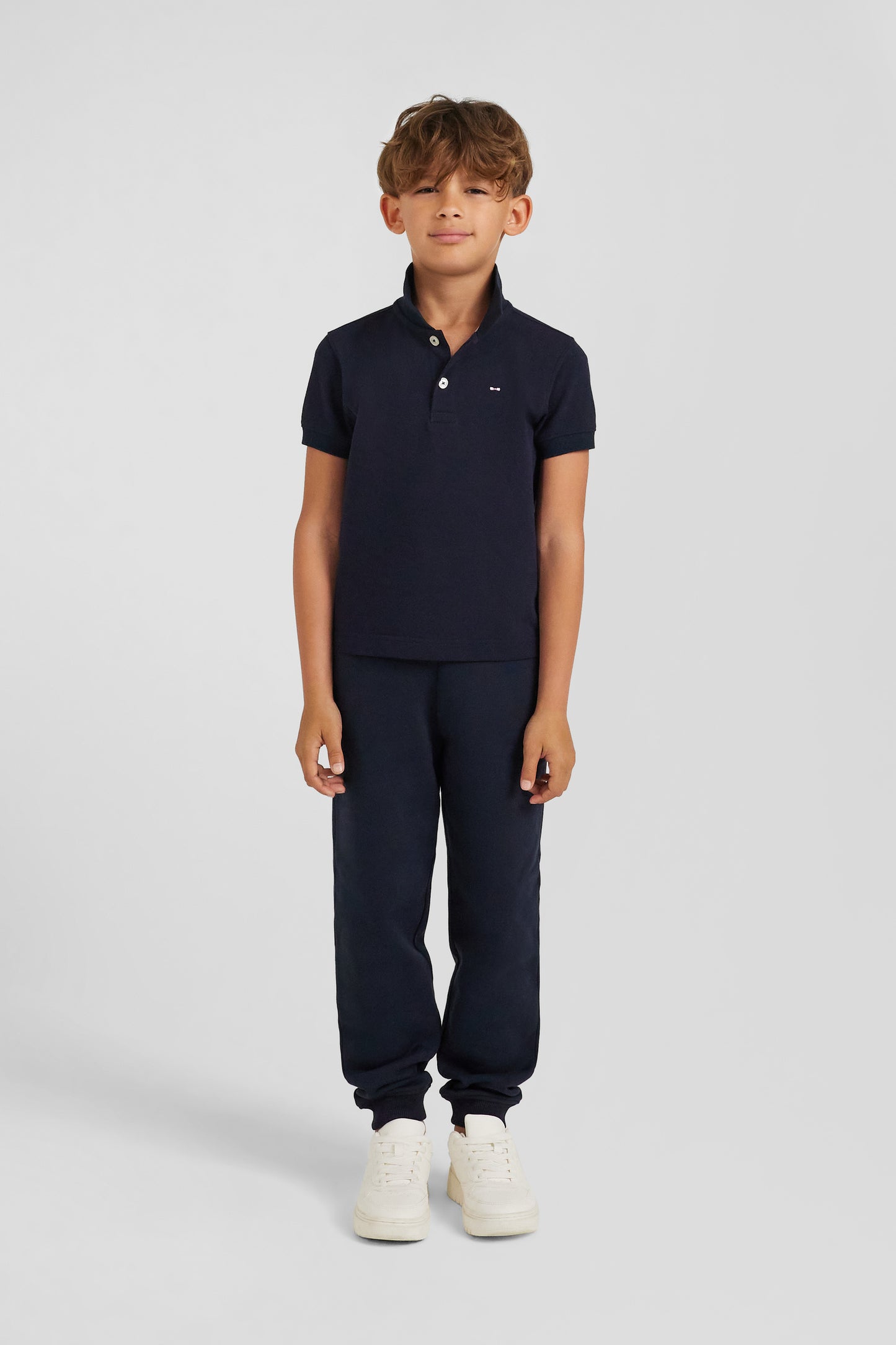 Regular navy blue short-sleeved cotton piqué polo shirt with back bow tie embroidery