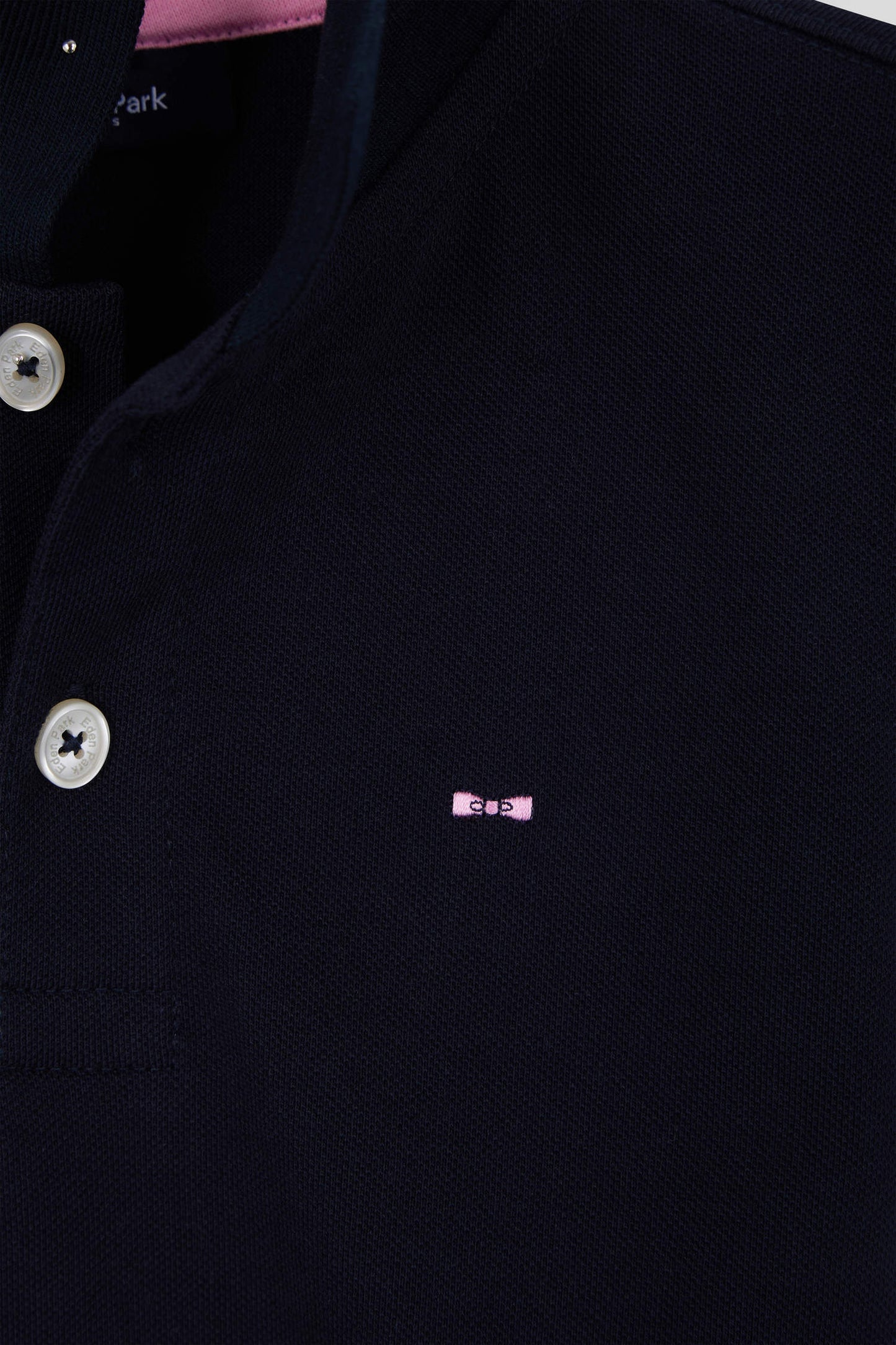 Regular navy blue short-sleeved cotton piqué polo shirt with back bow tie embroidery