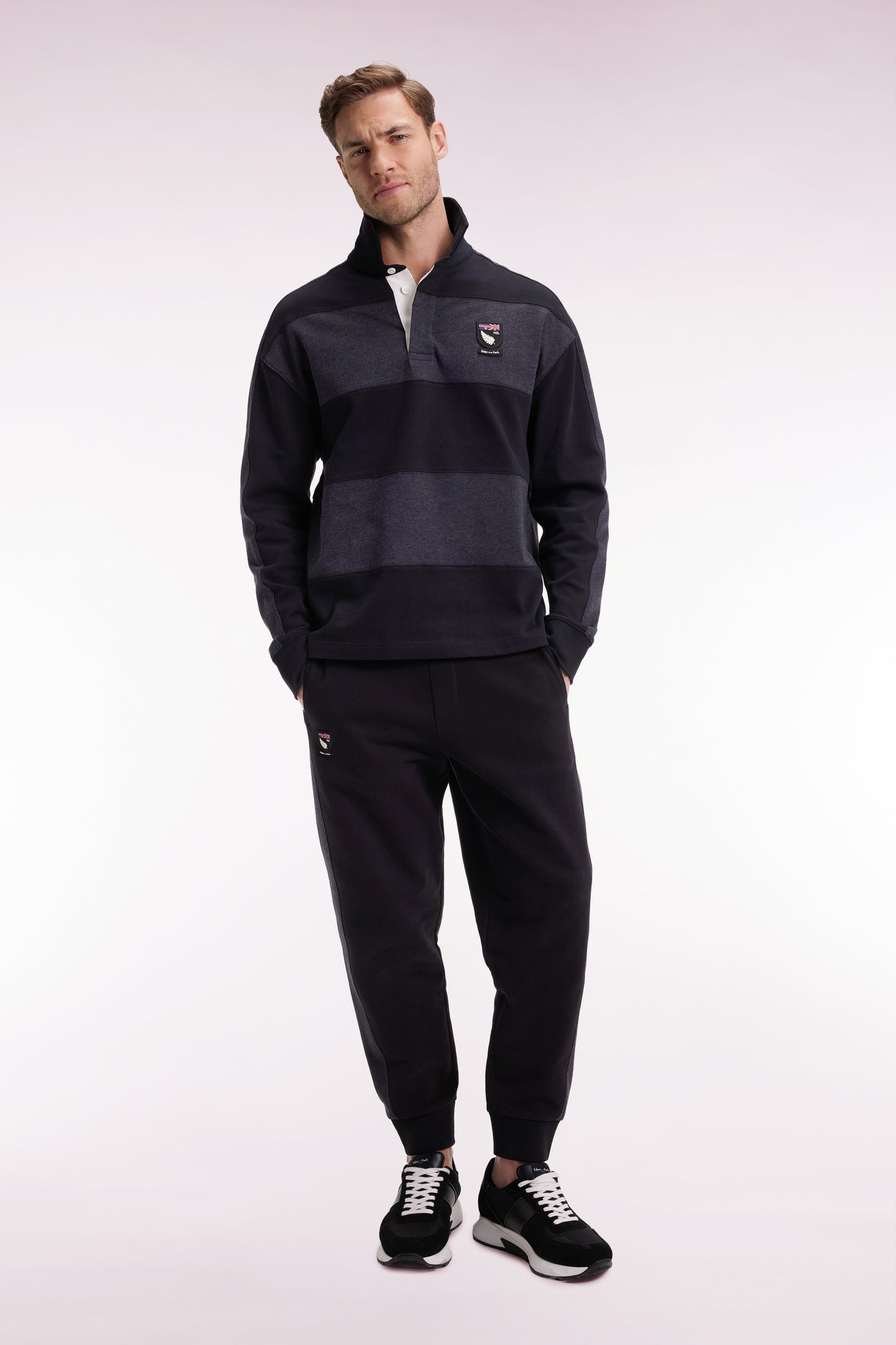Black brushed fleece jogging suit with striped pockets Relaxed cut