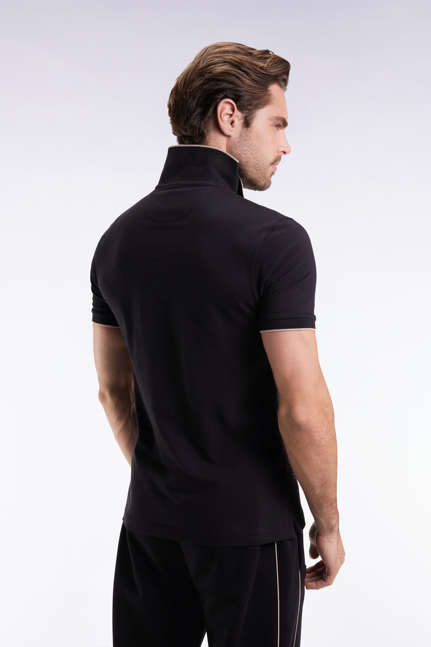 Short-sleeved polo shirt in black stretch cotton piqué with zip and slim fit