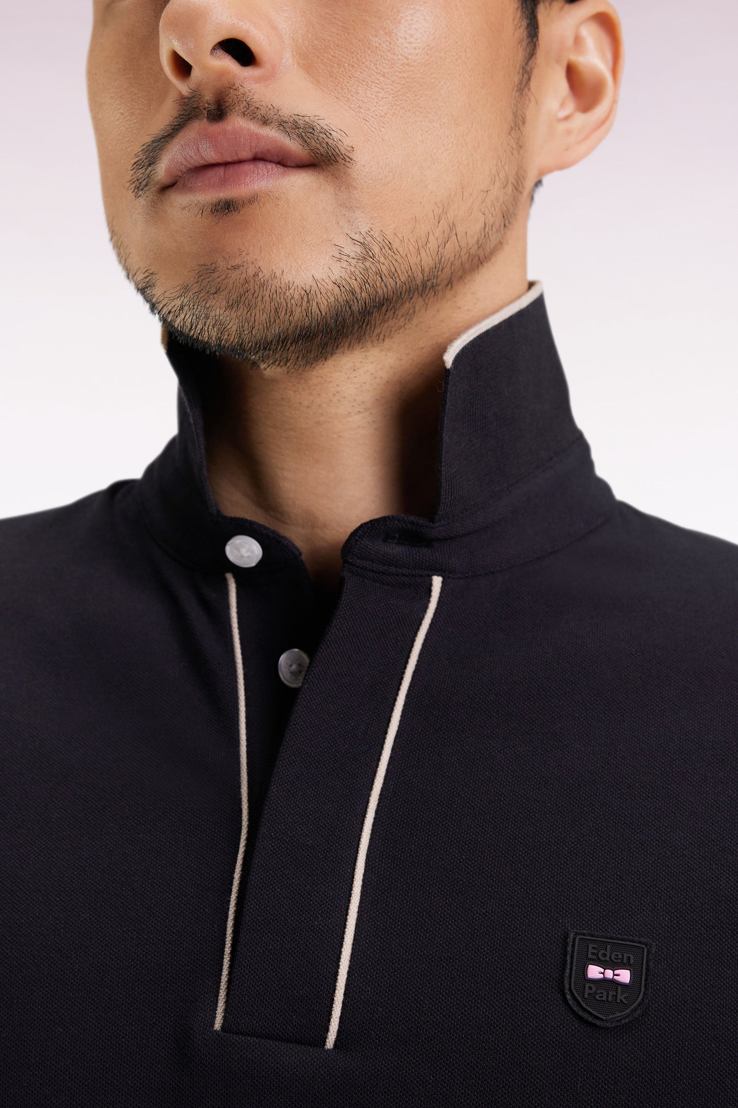 Long-sleeved polo shirt in black stretch cotton with piping, slim fit