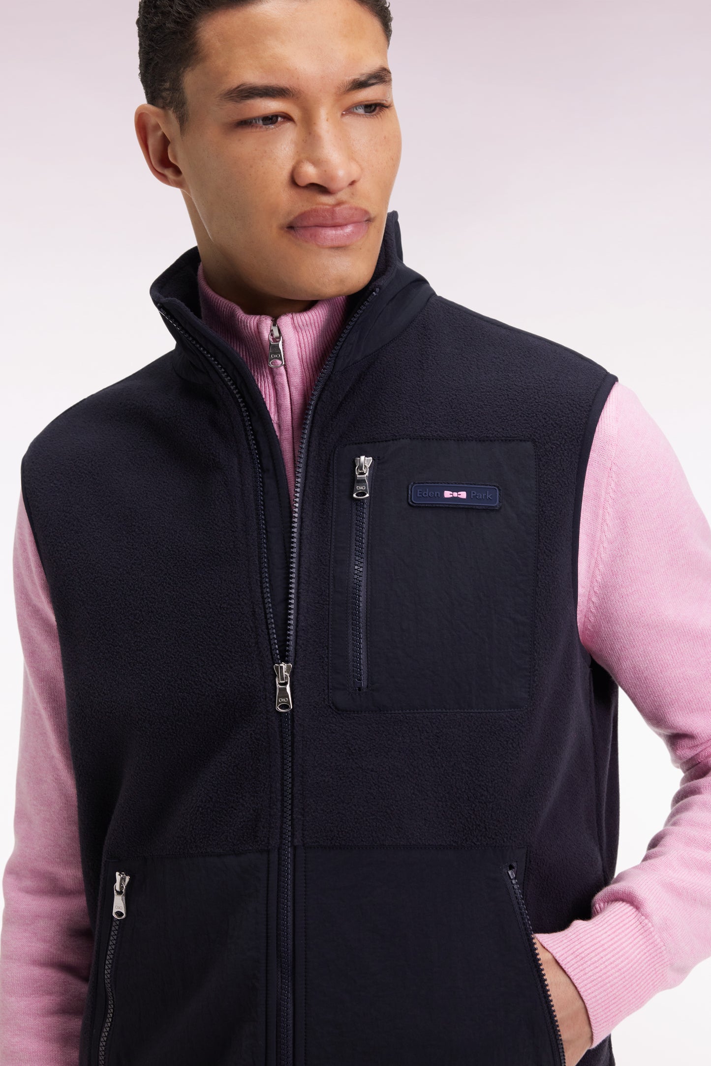 Sleeveless zip-up hooded sweatshirt in navy with straight cut.