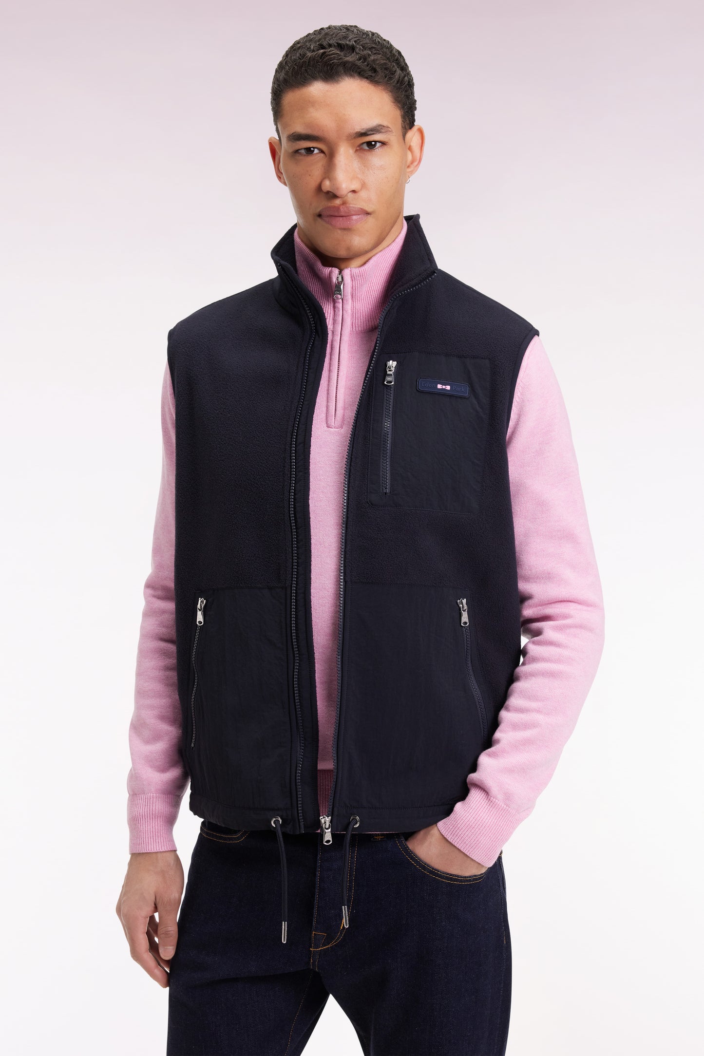 Sleeveless zip-up hooded sweatshirt in navy with straight cut.