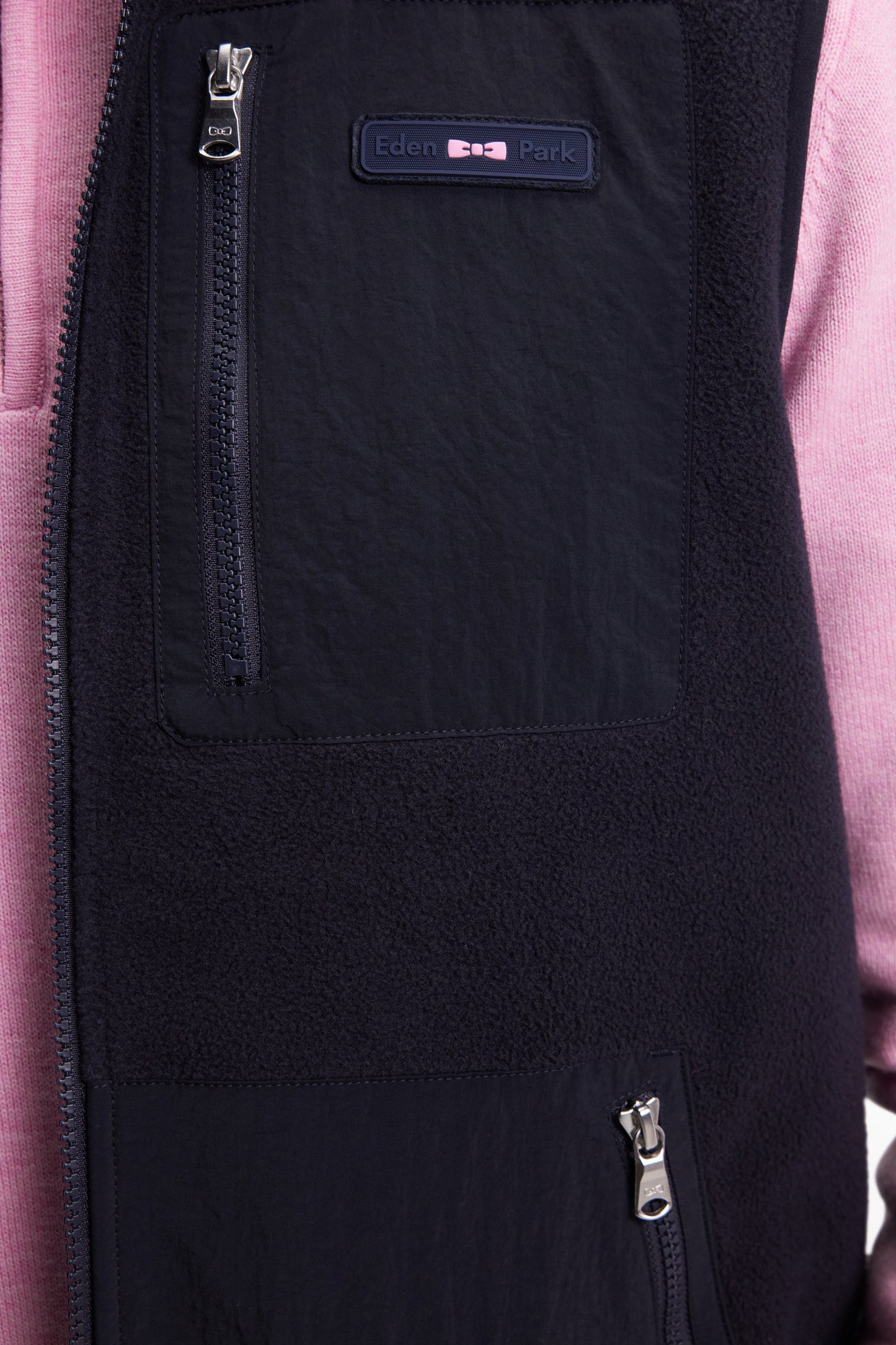 Sleeveless zip-up hooded sweatshirt in navy with straight cut.