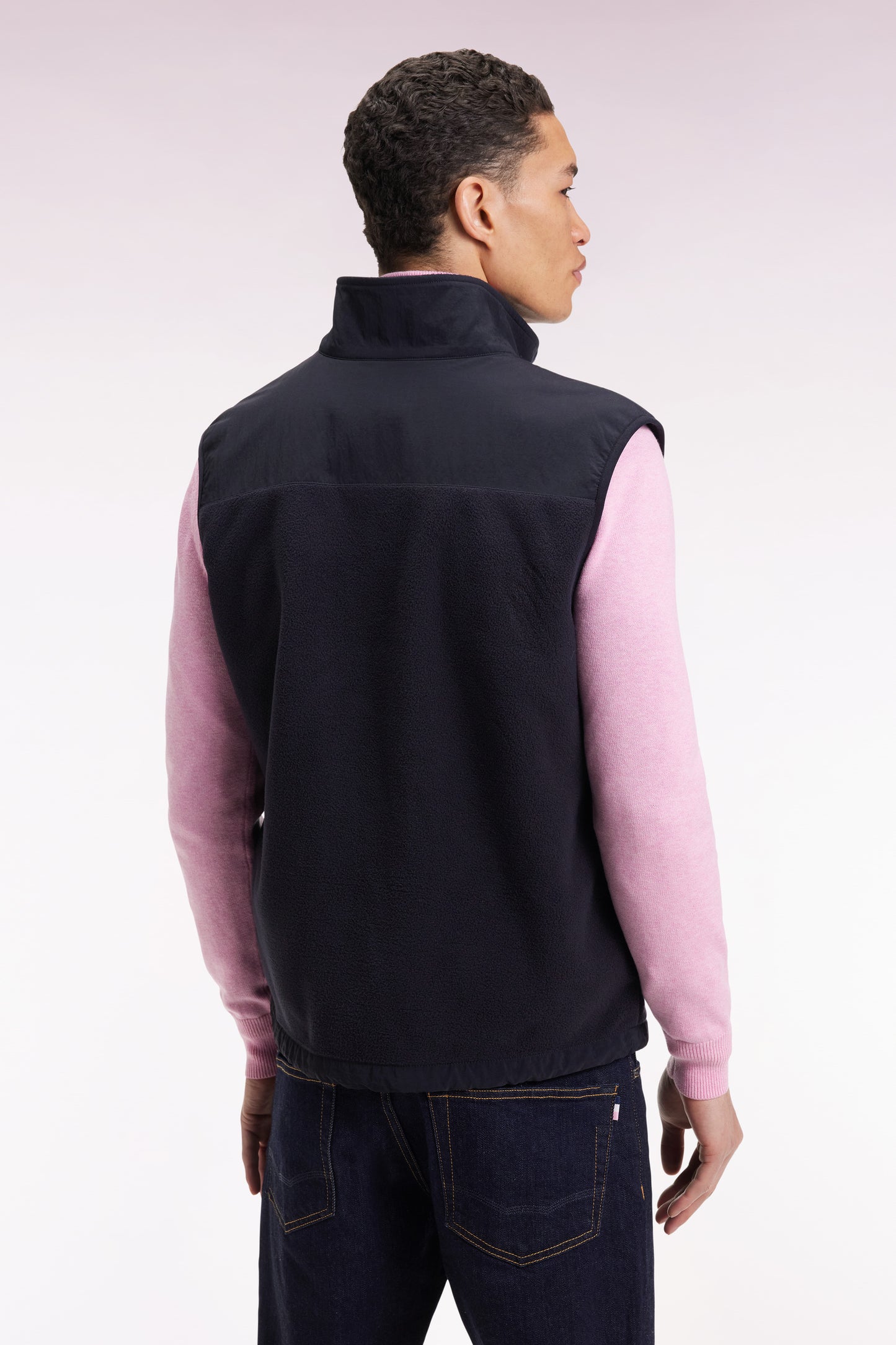 Sleeveless zip-up hooded sweatshirt in navy with straight cut.