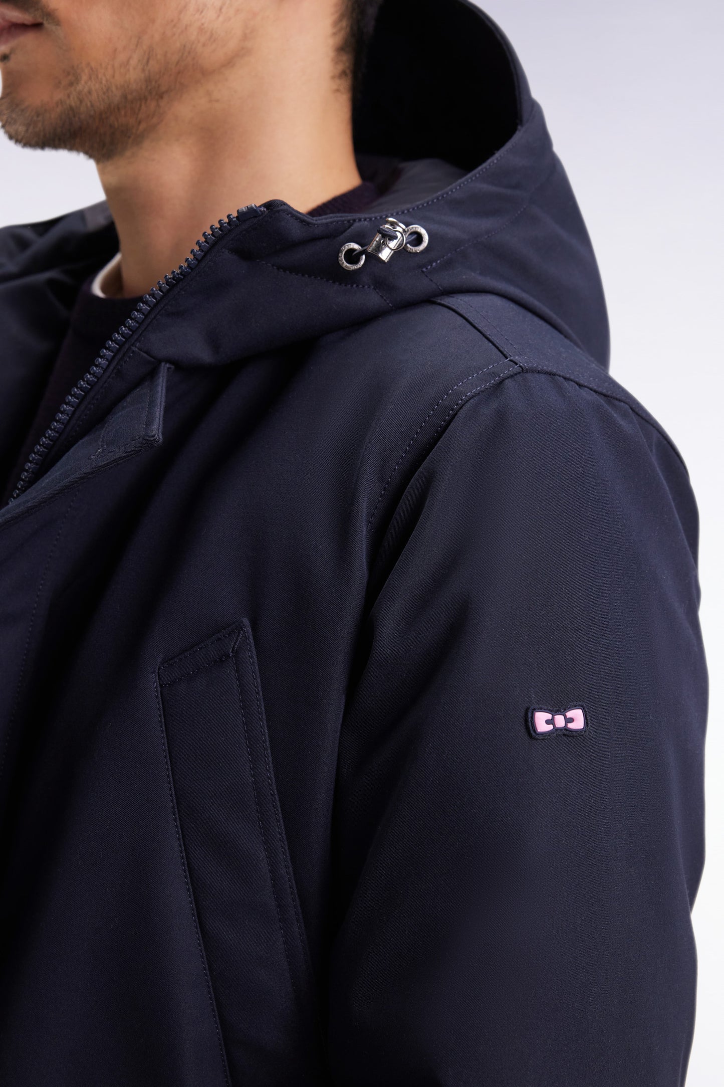 Short parka in navy nylon with patch pockets