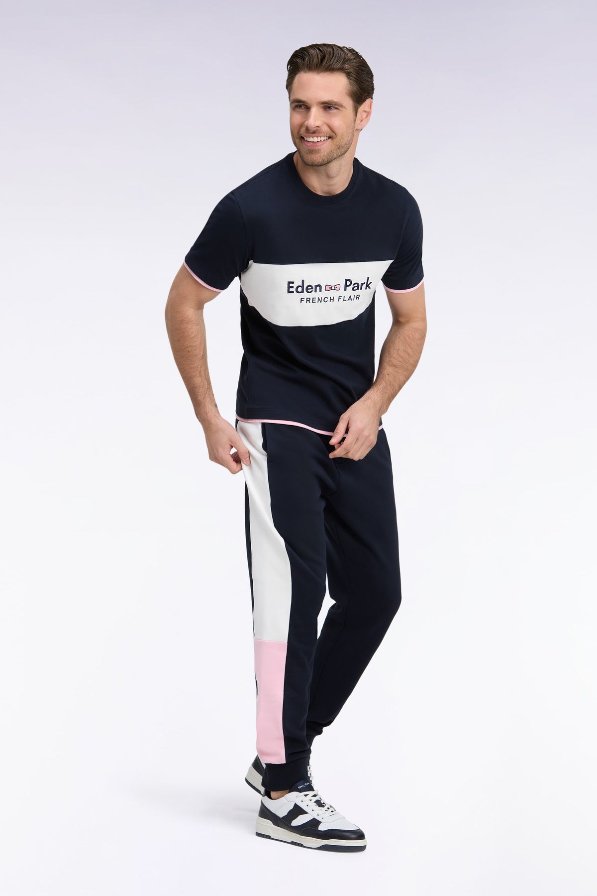 Navy fleece joggers with contrasting leg cutouts, straight cut