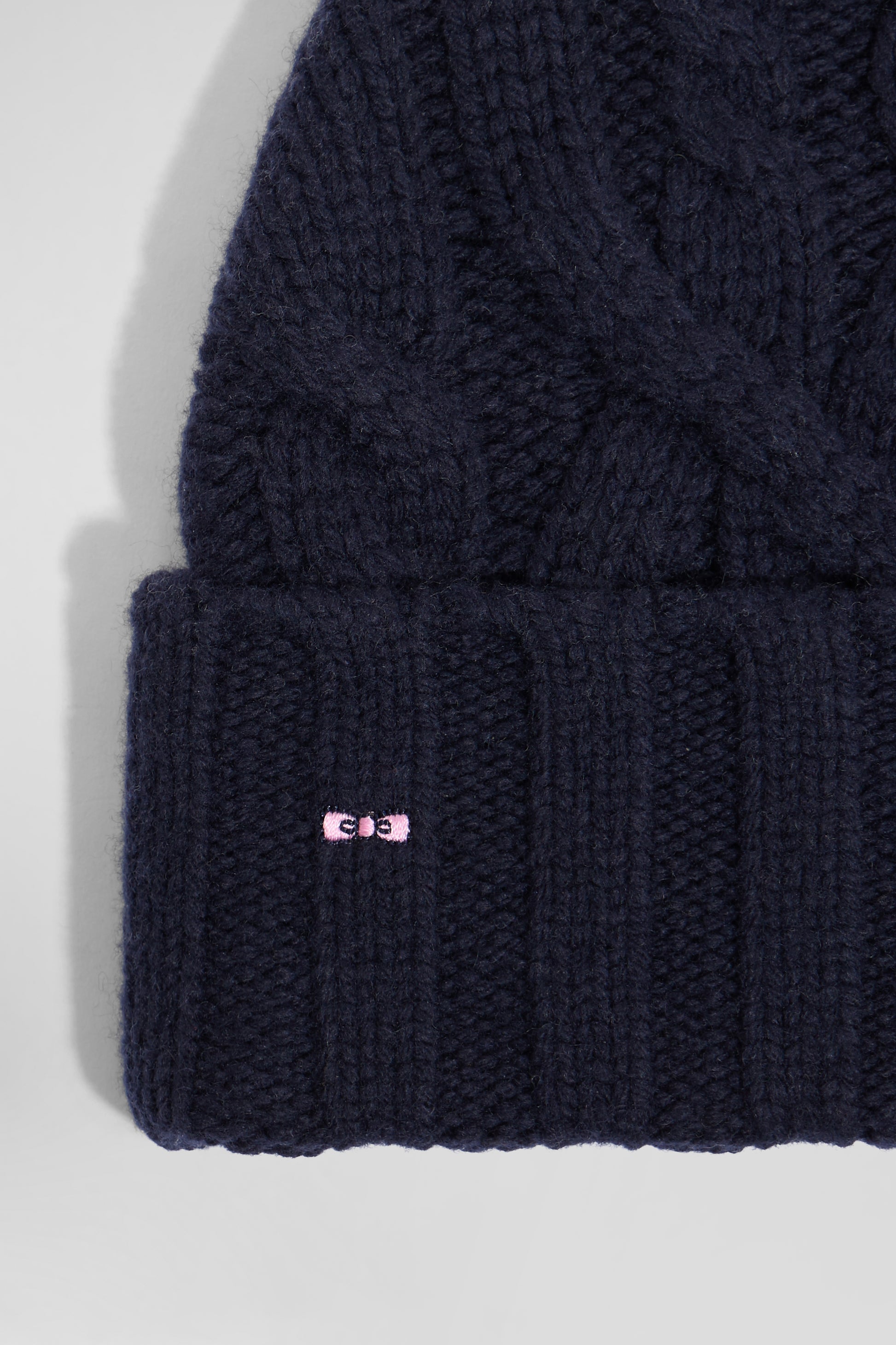 Navy blue cable knitted wool beanie