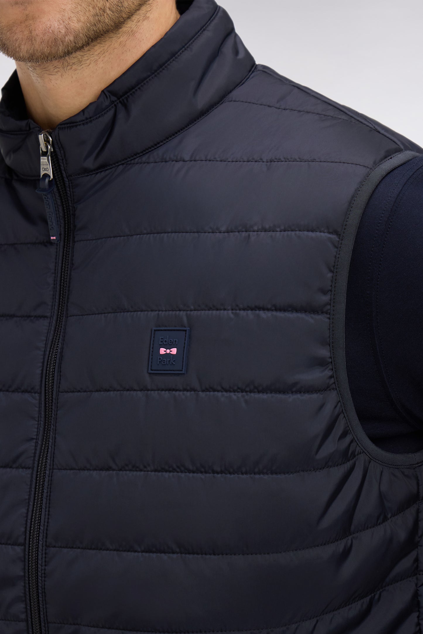 Navy blue sleeveless puffa jacket