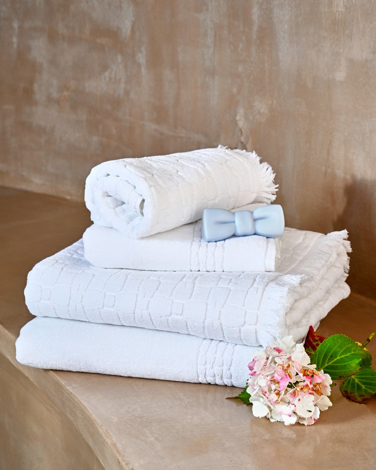 White cotton hand towel with micro bow tie patterns