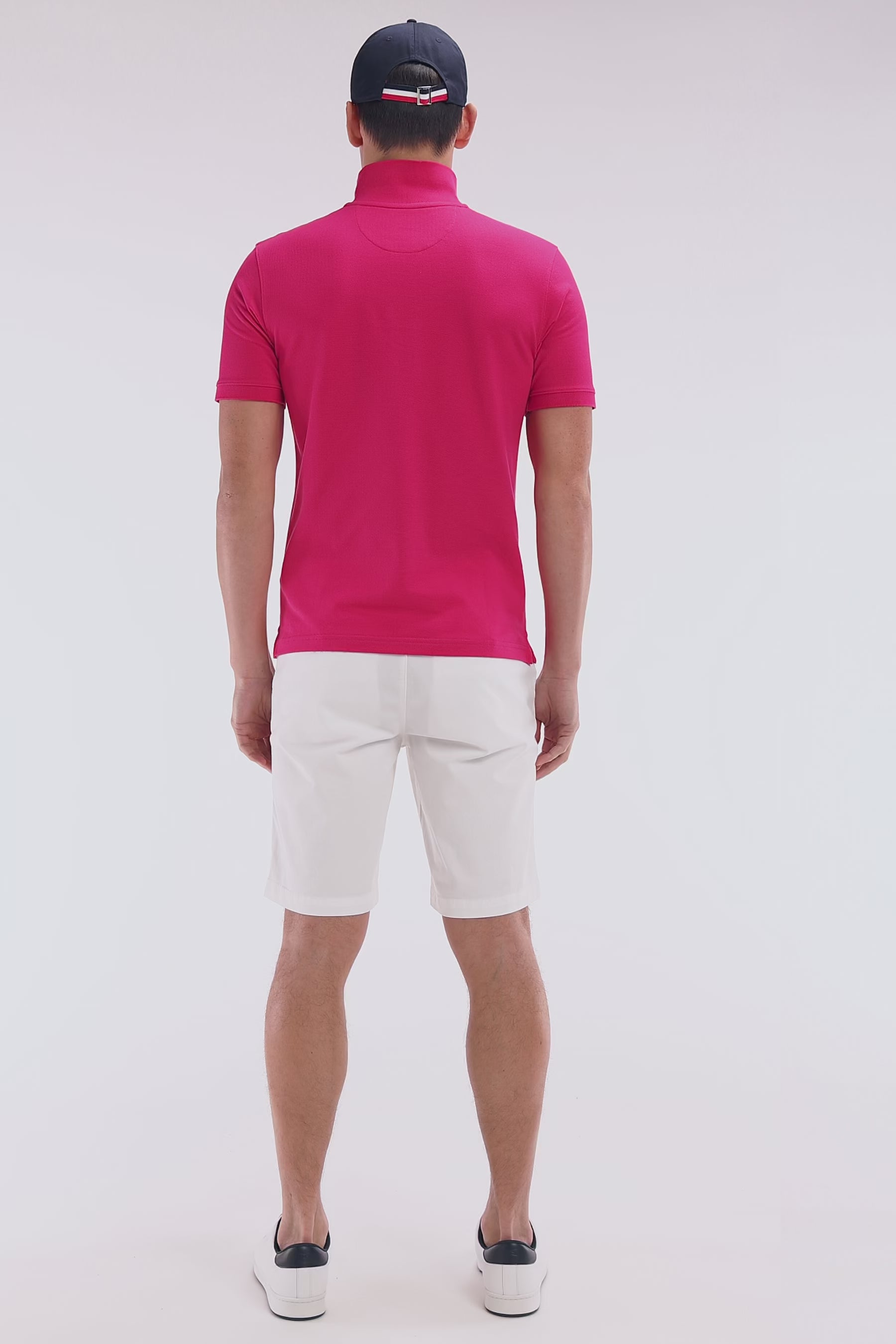 Polo à manches courtes uni en coton Pima fuchsia coupe droite