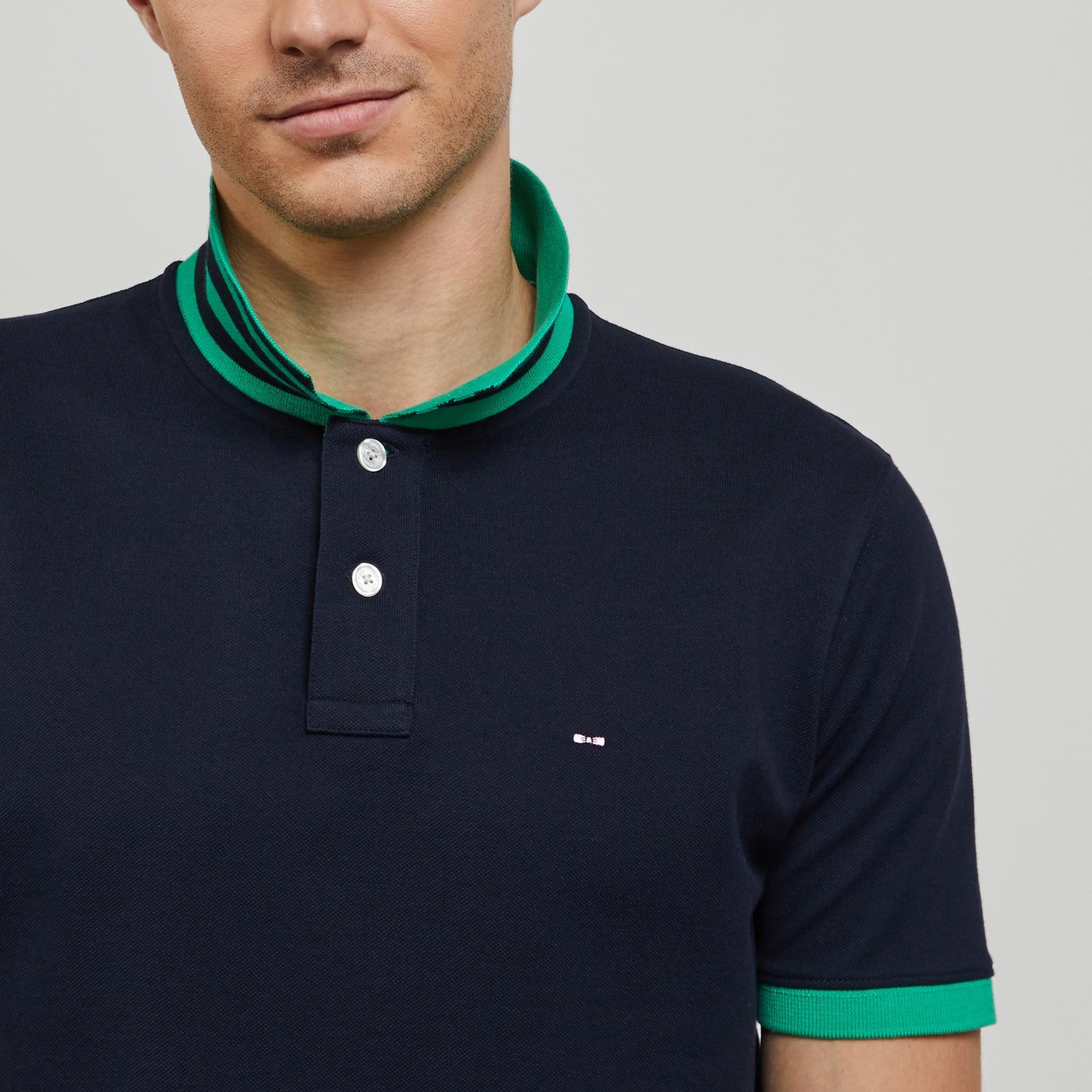 Dark blue polo with green trims, in Pima cotton