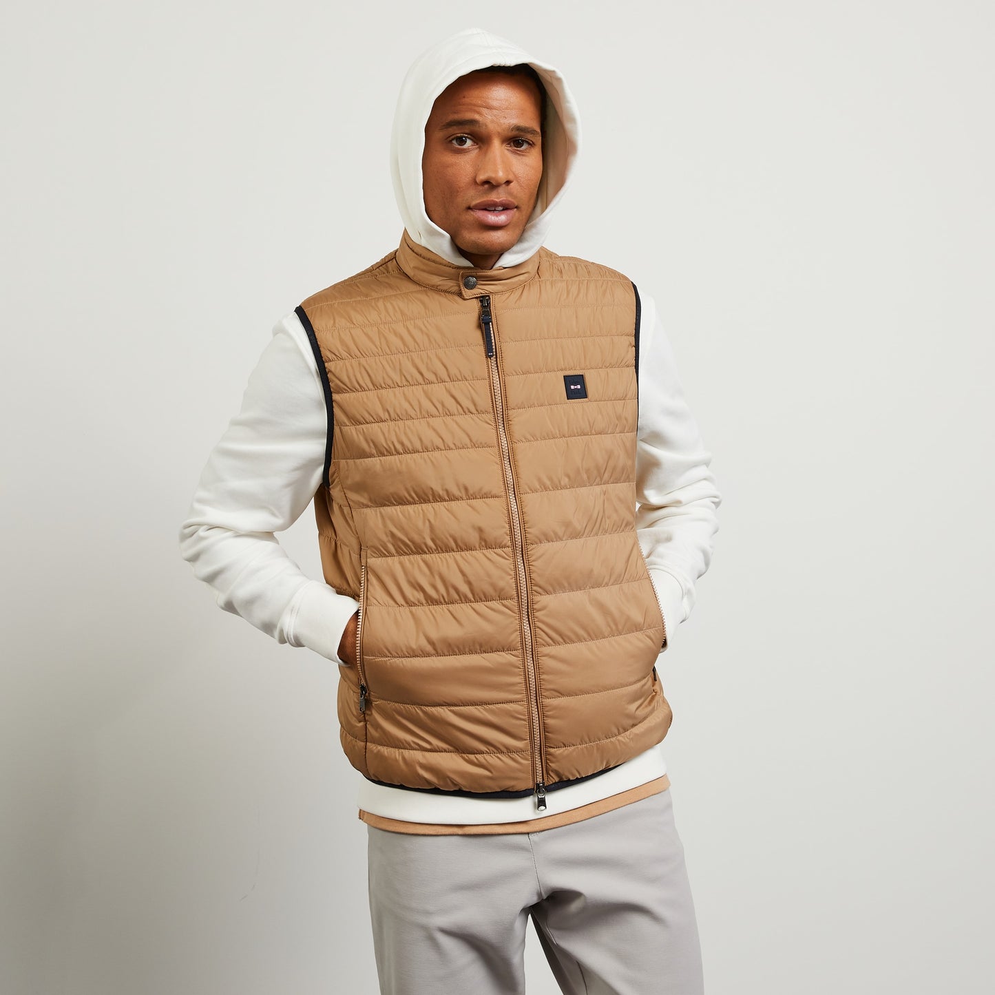 Beige sleeveless puffa jacket